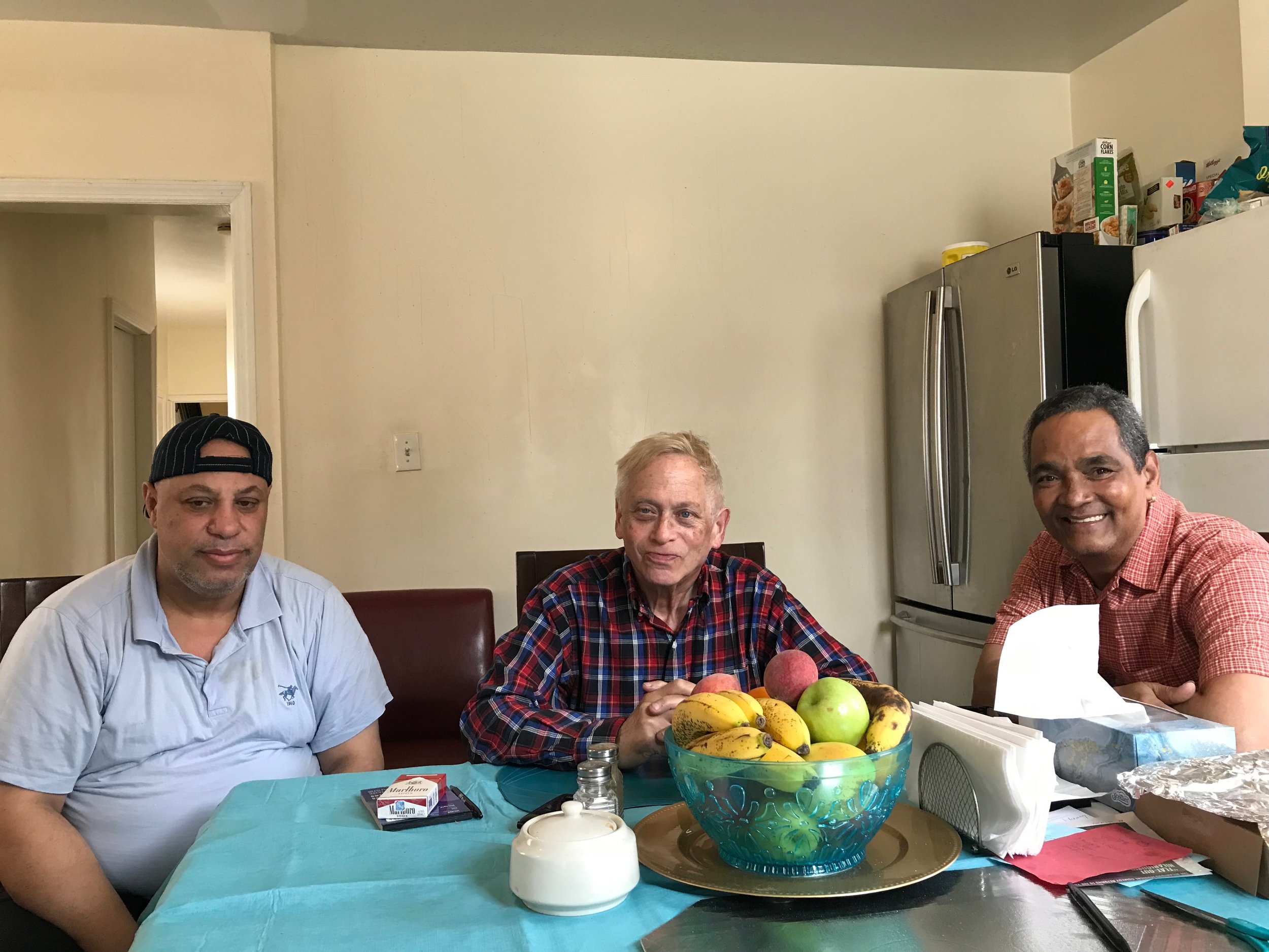 Khamis Mohamed (left), Bill Lindauer (center) and Edwin Amadeo face an uncertain future at their Long Island City apartment building. Eagle photo by David Brand.