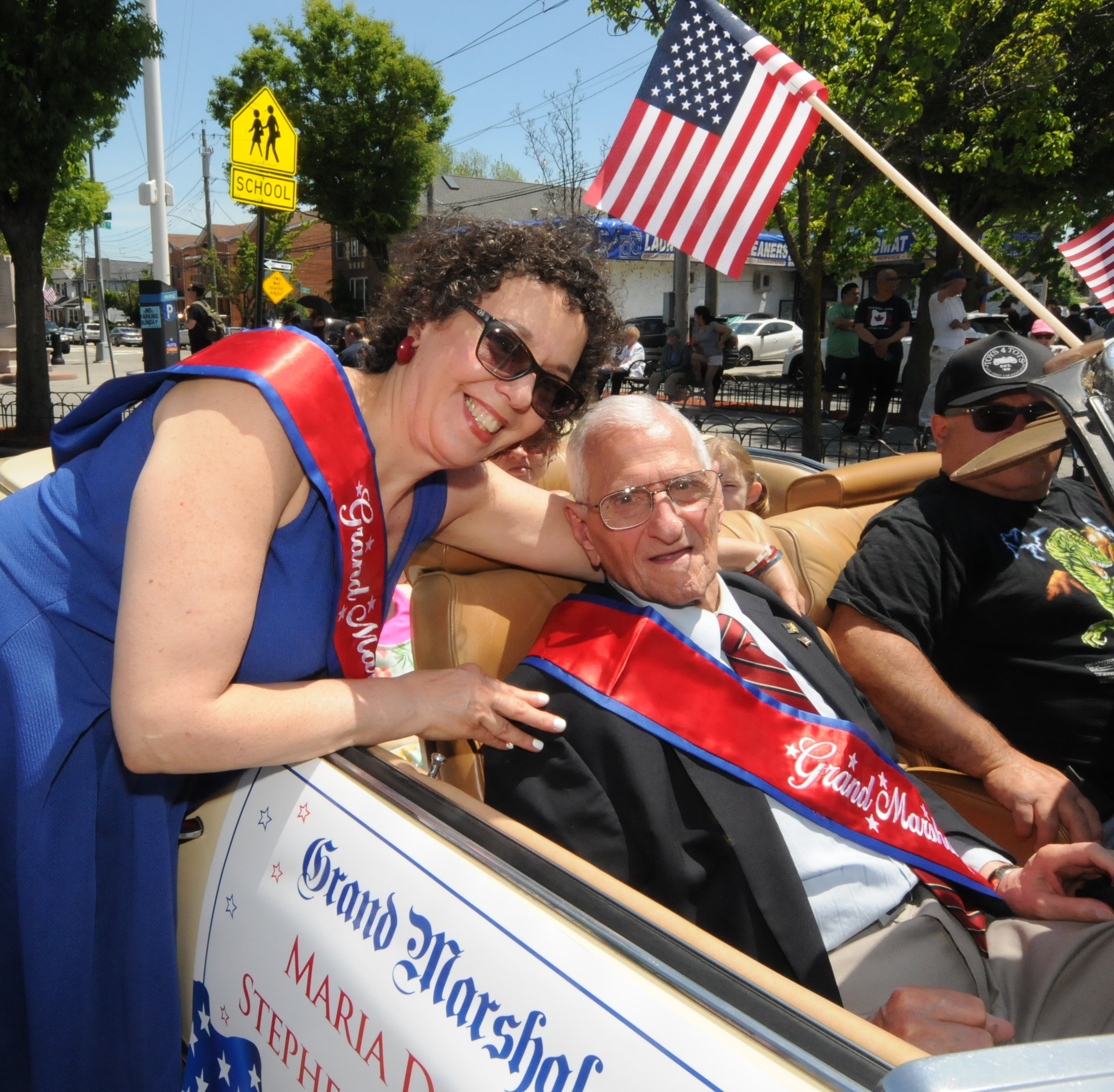  Grand Marshals share a light-hearted moment before the parade kick-off. Director of the Self-Help Maspeth Senior Center Maria Dixon (left) and World War II veteran Stephen Marrone.    
