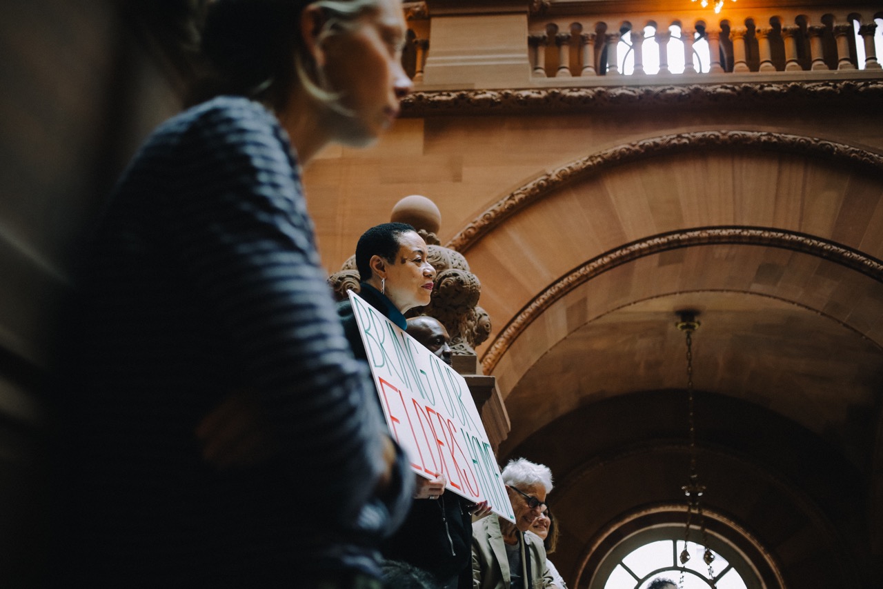 Activist Della Johnson attends an Albany rally to release older adults from prisons. Photo via RAPP.