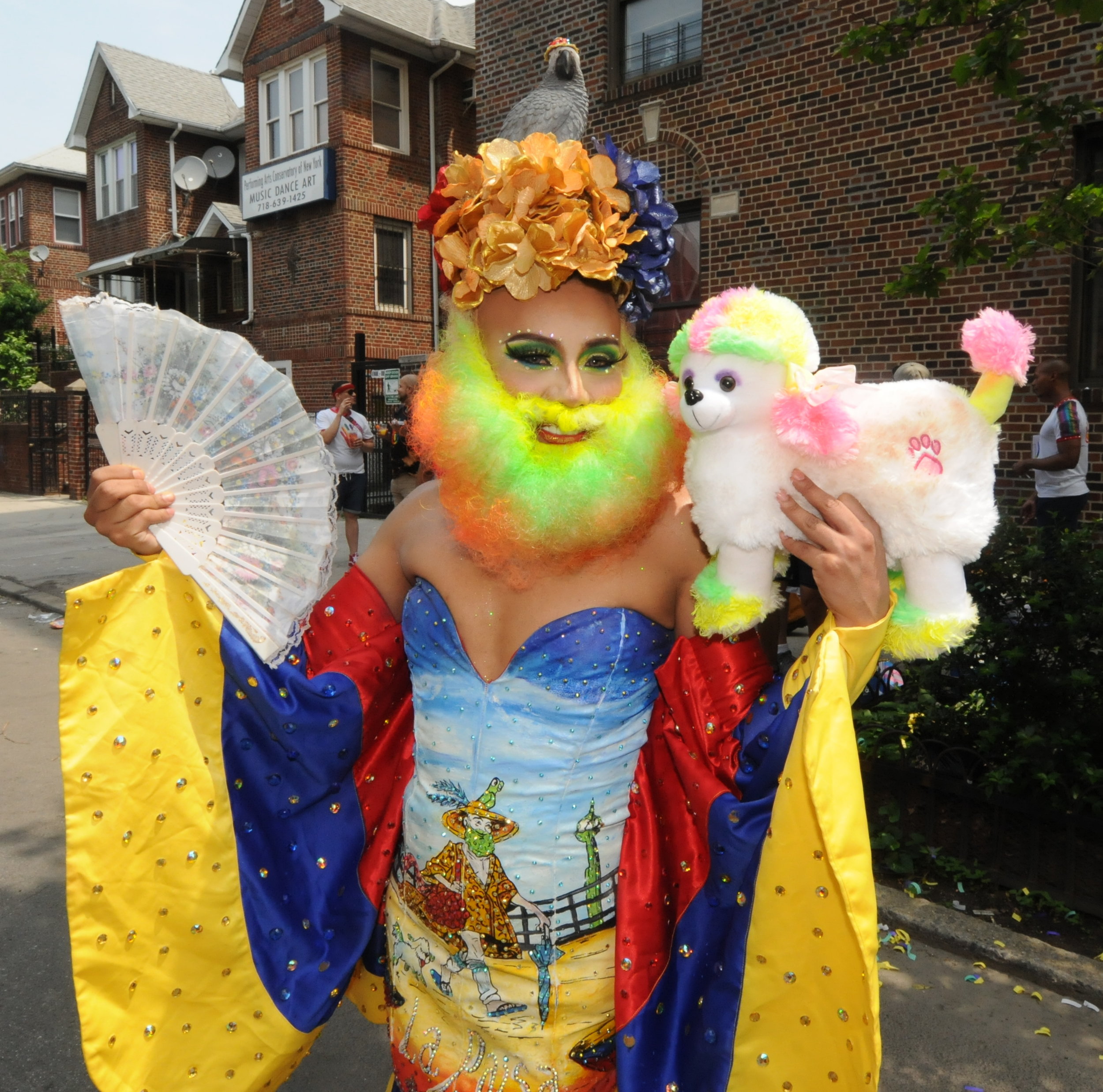  Ashley Hernandez pays costumed tribute to the late “Ms. Colombia,” Oswaldo Gomez, who died in October 2018.   