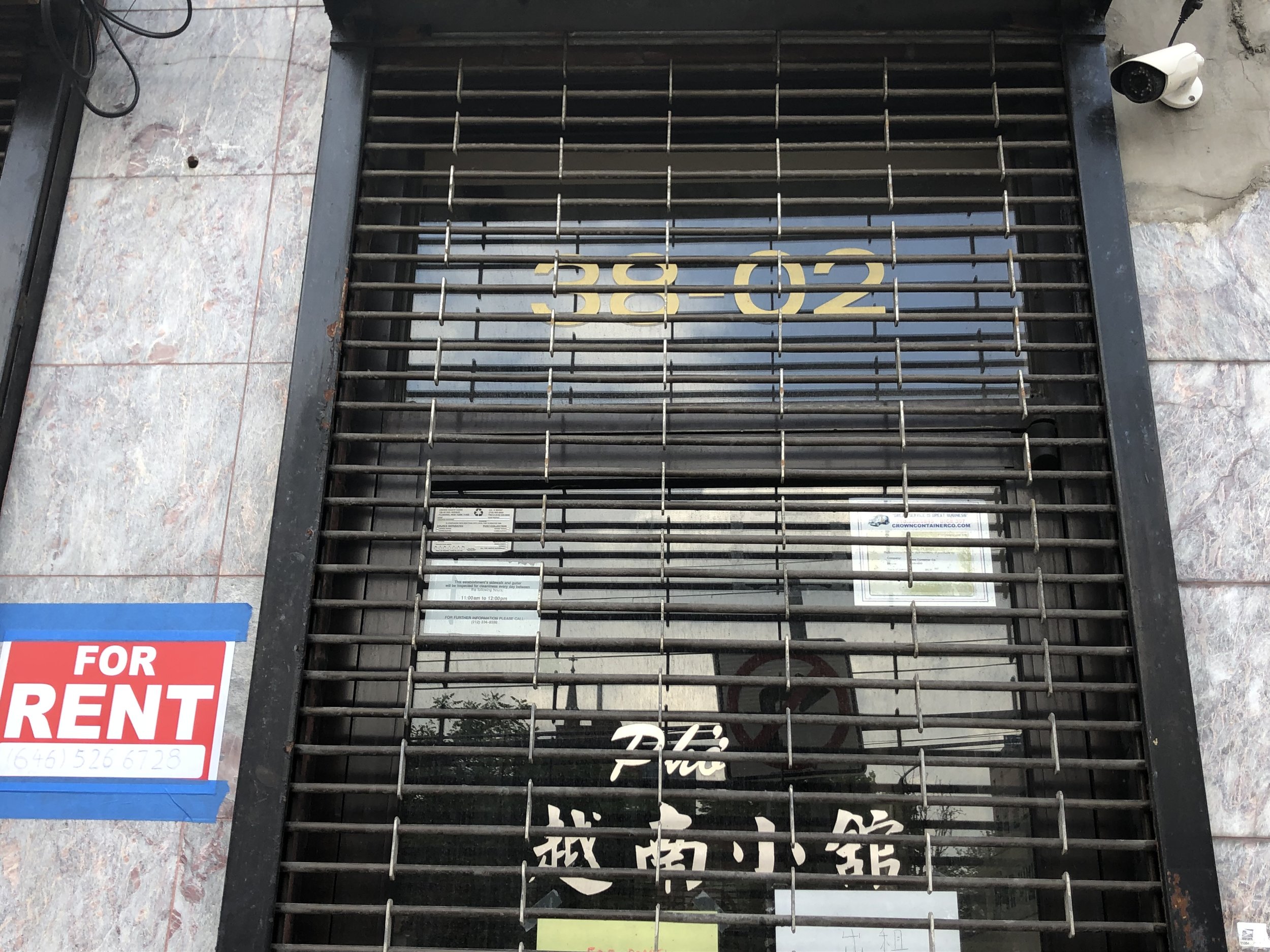 A shuttered business in Flushing. Smaller shops have been forced to close over the past year due to exorbitant rent hikes.