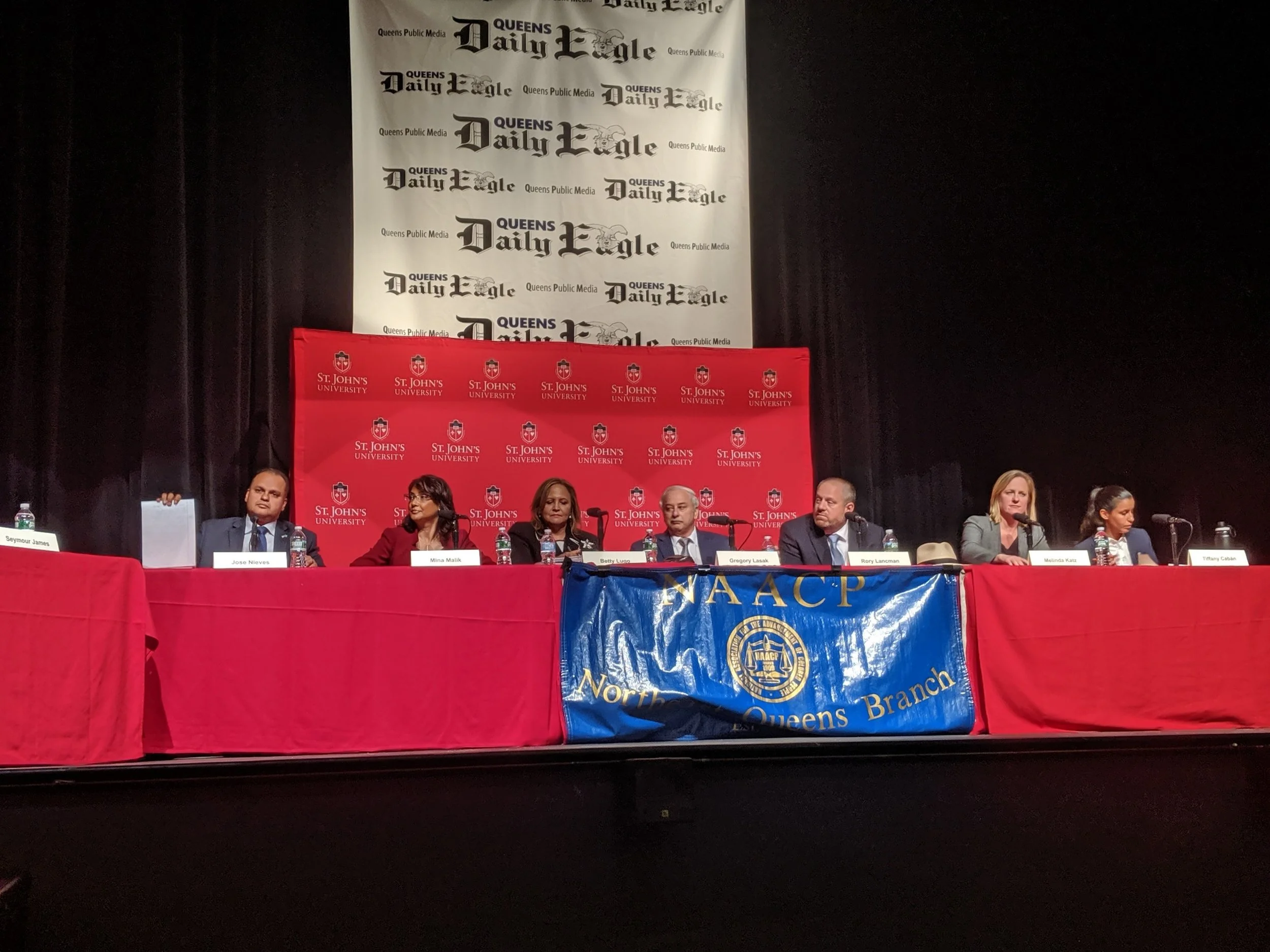 The seven candidates for Queens DA spoke at a forum hosted by the Eagle Thursday: public defender Tiffany Cabán, Borough President Melinda Katz, Councilmember Rory Lancman, former Judge Gregory Lasak, attorney Betty Lugo, former Civilian Complaint Review Board Director Mina Malik and former state Attorney General’s Office prosecutor Jose Nieves. Eagle photo by Phineas Rueckert.
