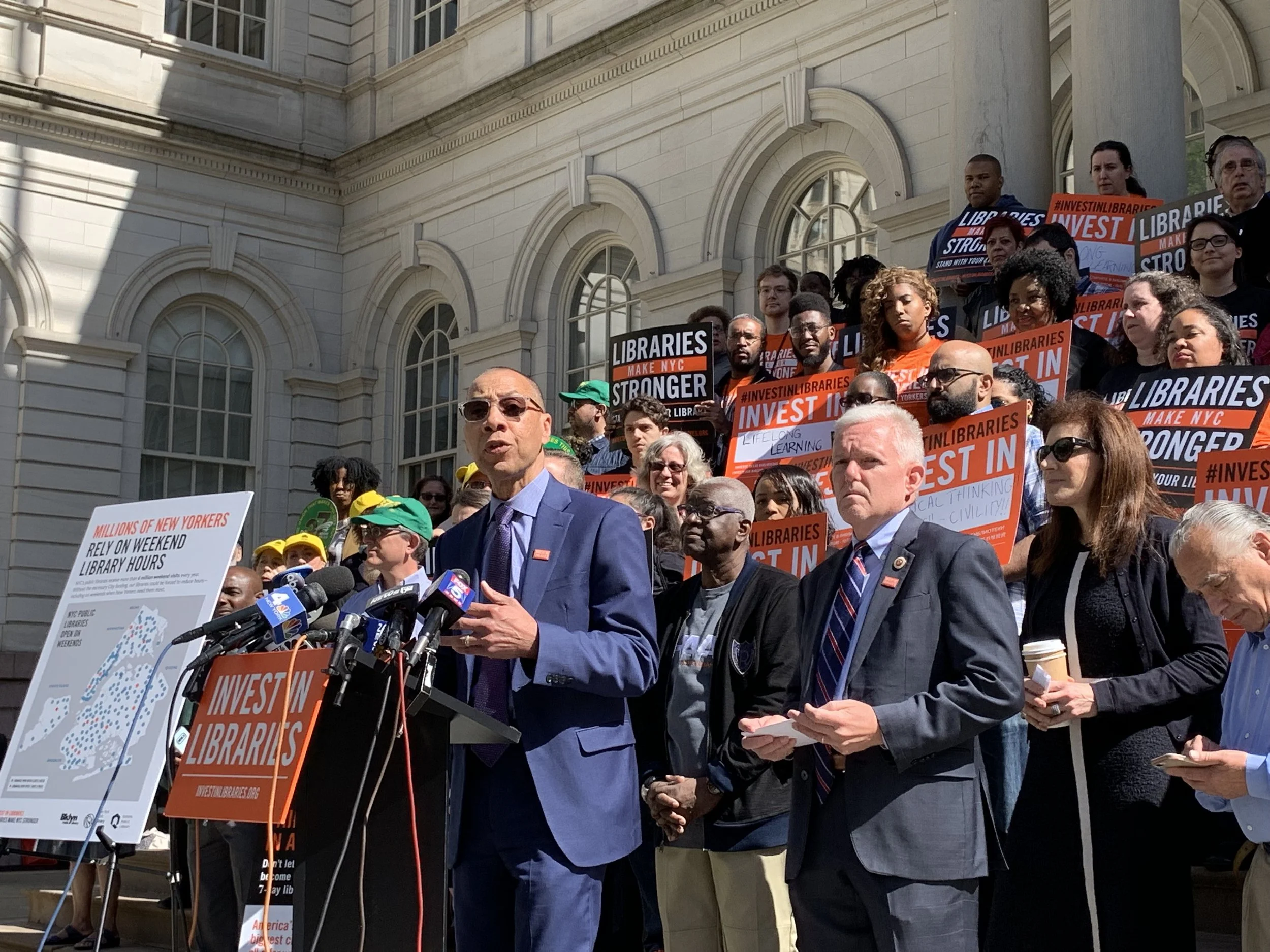 QPL President Dennis Walcott rallied on the steps of City Hall in May after Mayor Bill de Blasio proposed millions of dollars in library cuts. Photo courtesy of the Queens Public Library.