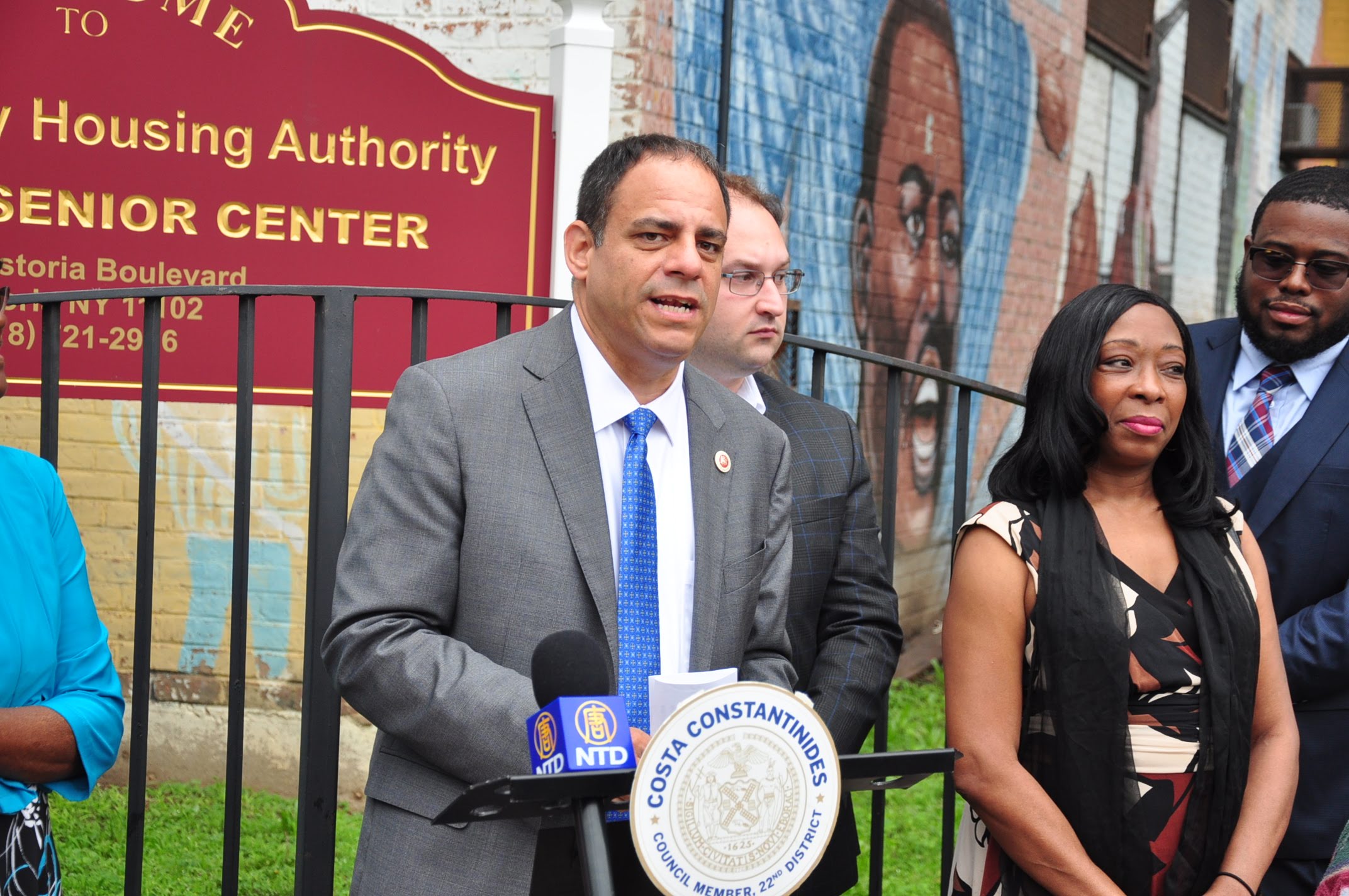 Councilmember Costa Constantinides speaks in front of the Astoria Houses on Thursday. He helped advocate for the buildings’ senior center to remain open.