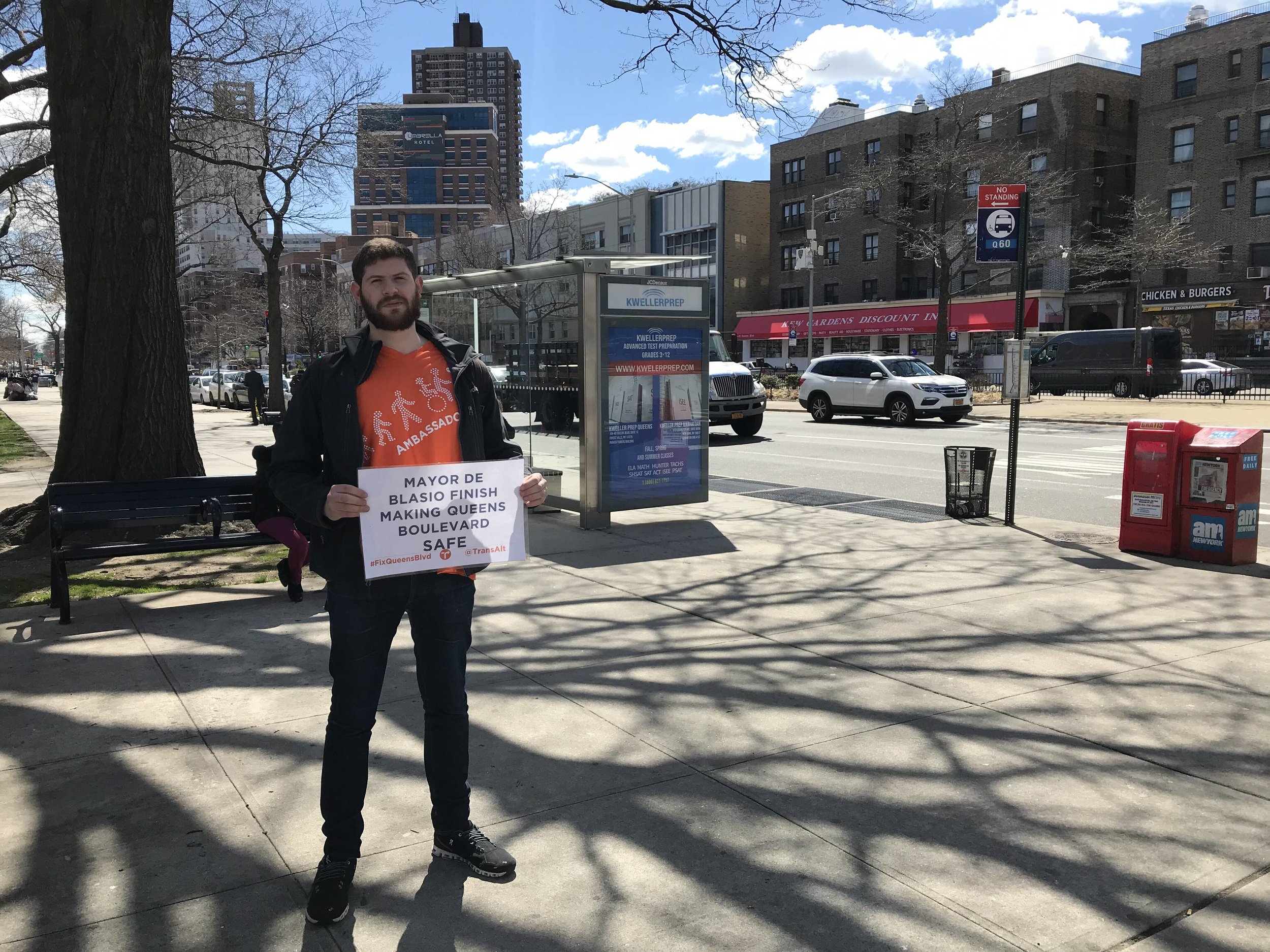 Transportation Alternatives’ Clark Vaccaro advocates for the city to complete bike lanes on Queens Boulevard in April. Eagle file photo by David Brand.