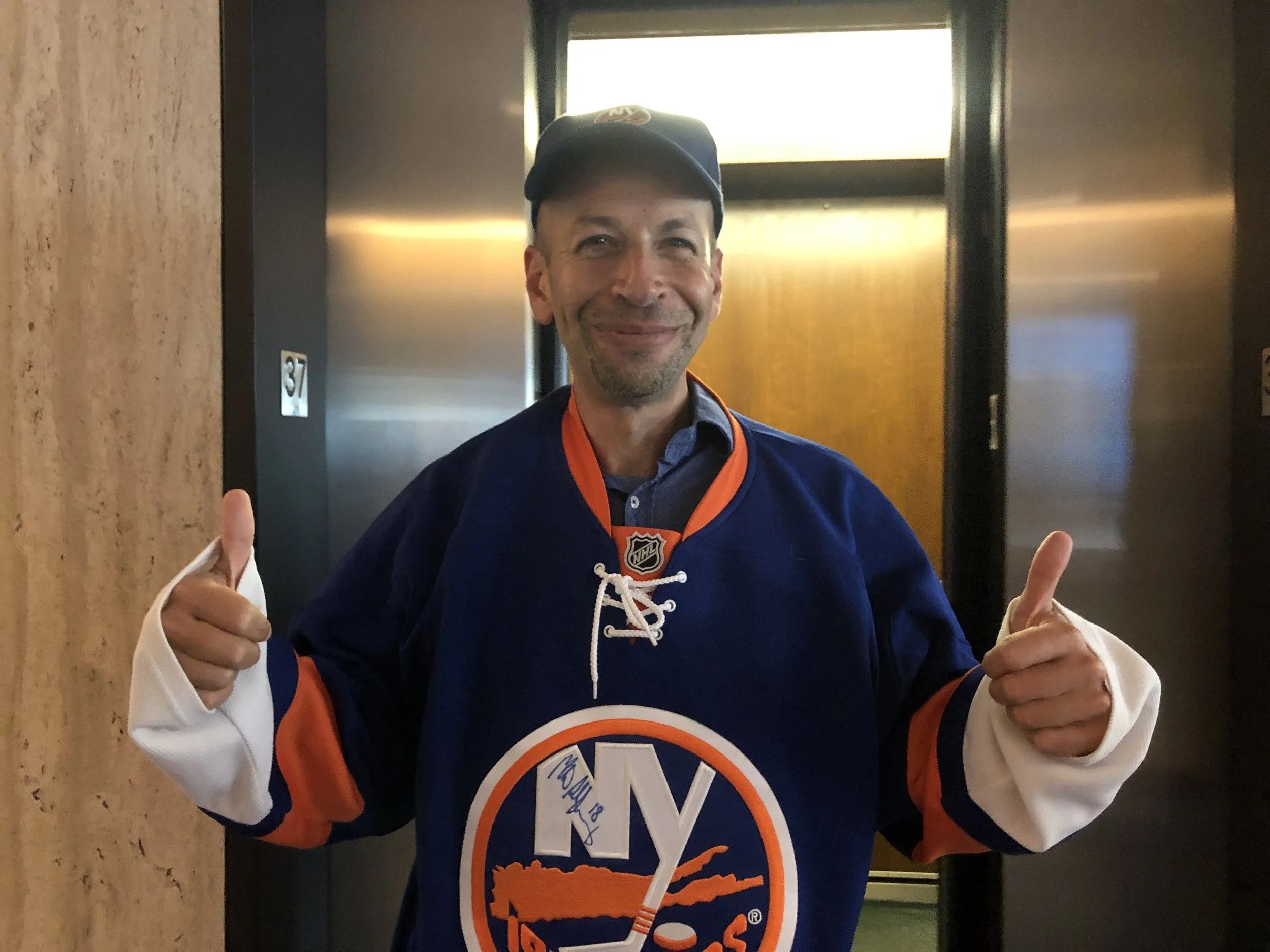 Islanders fan Sam Schneider said he approves of a project to build a new arena in Elmont, Long Island, just over the Queens border. Eagle photo by Naeisha Rose.