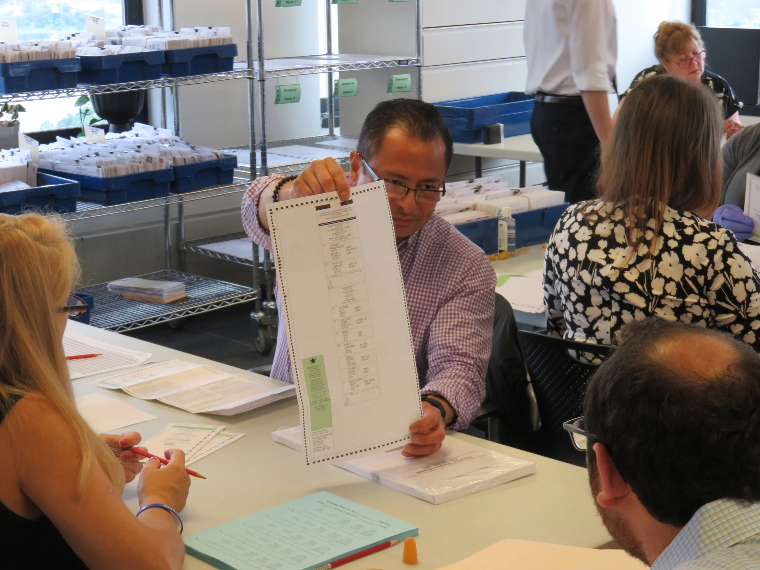 Board of Elections officials begin to organize ballots ahead of the recount in the Democratic primary for Queens district attorney. Eagle photo by David Brand.
