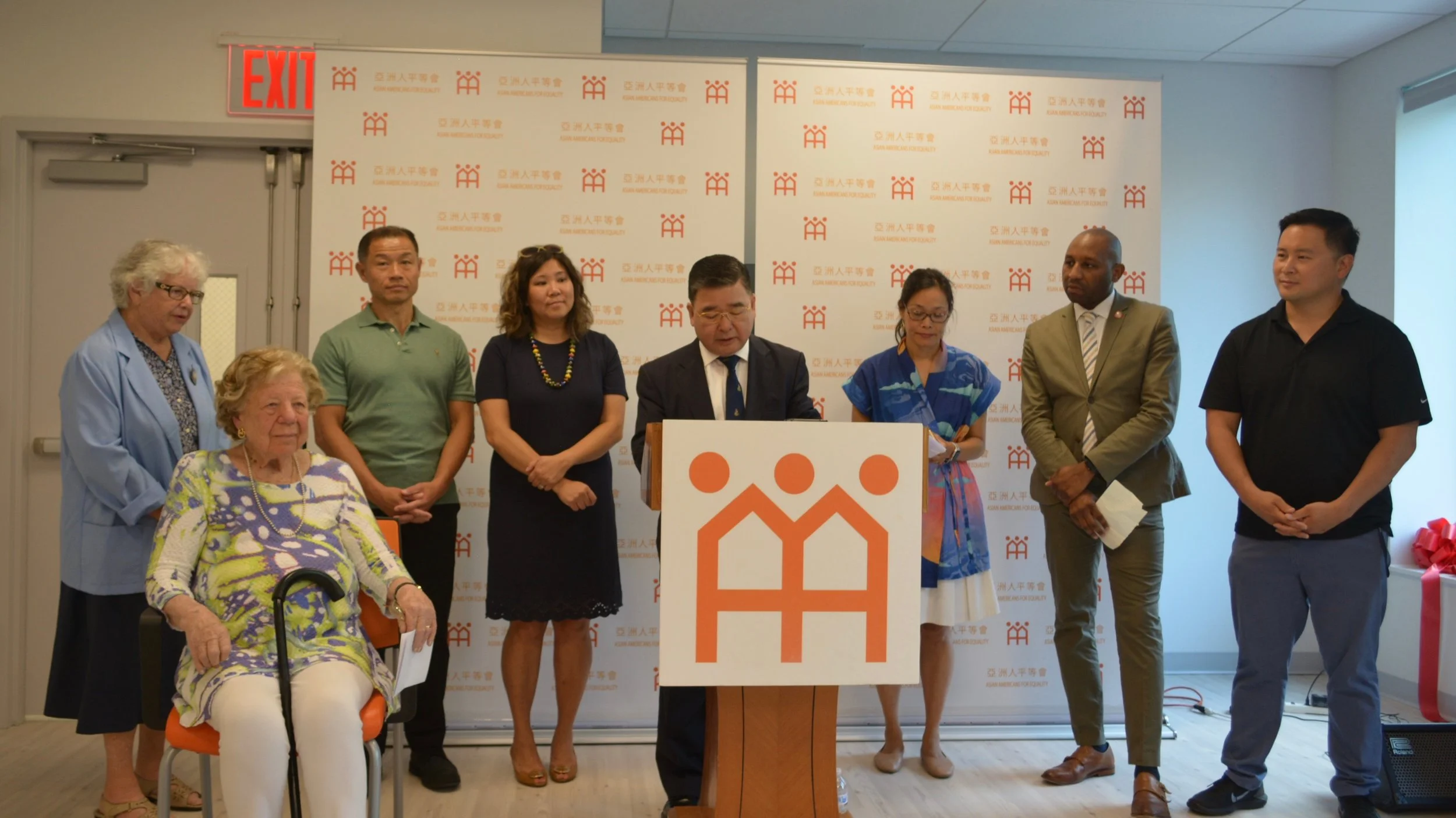 Councilmember Peter Koo speaks at a ribbon cutting for AAFE’s new Flushing headquarters. Photo courtesy of AAFE.