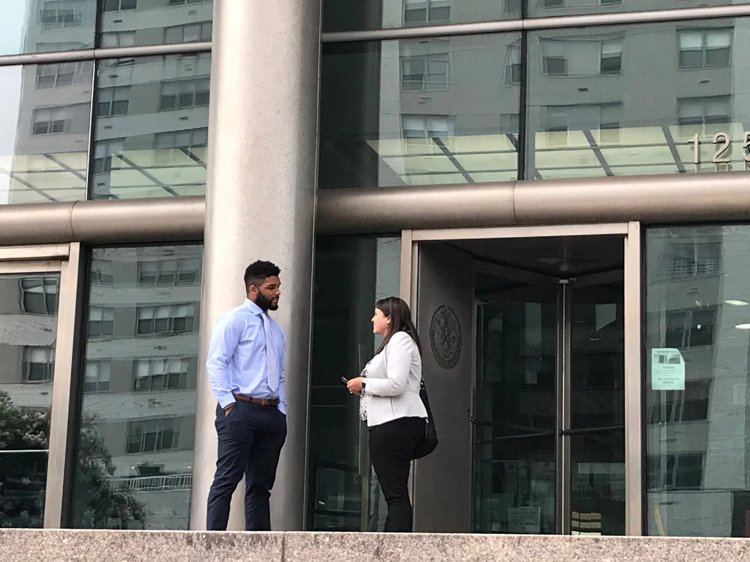 NFL linebacker Trevor Bates exits Queens Supreme Court with his attorney Sarah Stewart of Duane Morris LLP on Tuesday. Eagle photo by David Brand.