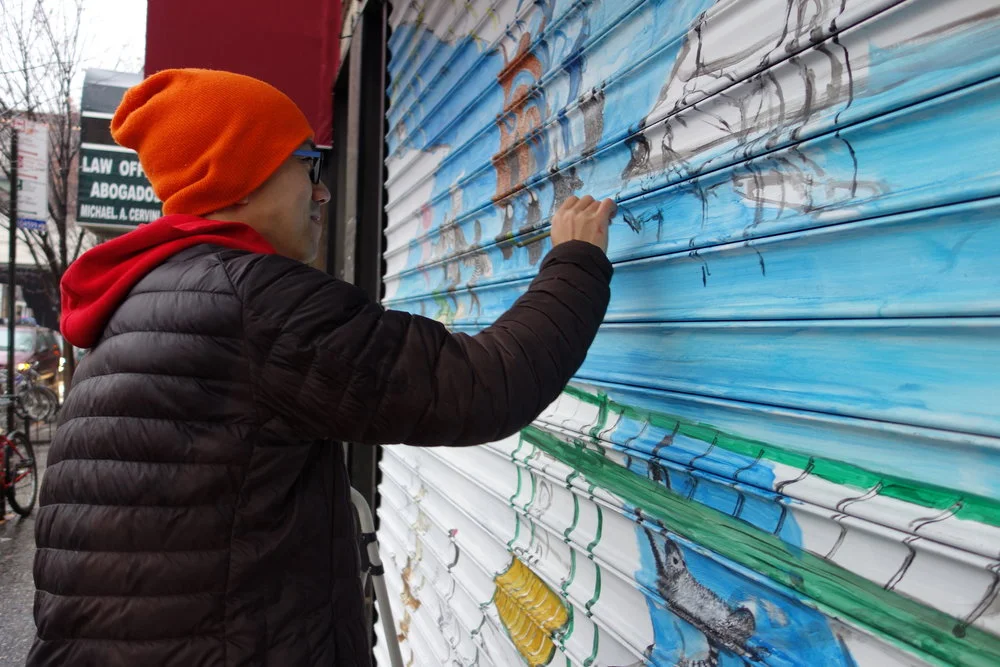Queens Council on the Arts grant recipient Chemin Hsiao paints a mural as part of the ArtSite piece, " My Journey to the West III: Playground .” Photo via QCA