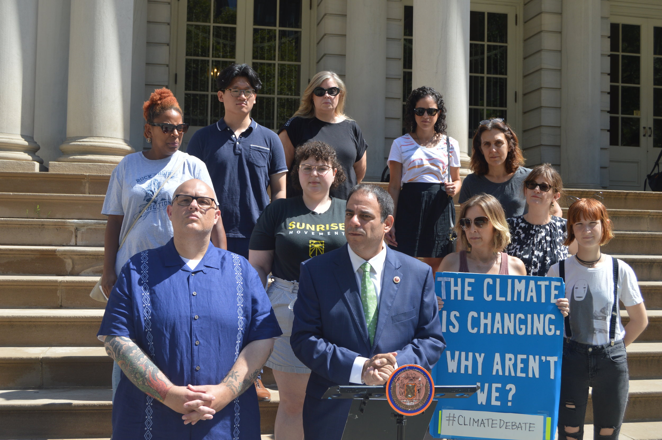 Queens and Brooklyn leaders gathered at City Hall Friday to ask that CNN’s climate town hall be hosted in either of the outer boroughs. Photo courtesy of Constantinides’s office.
