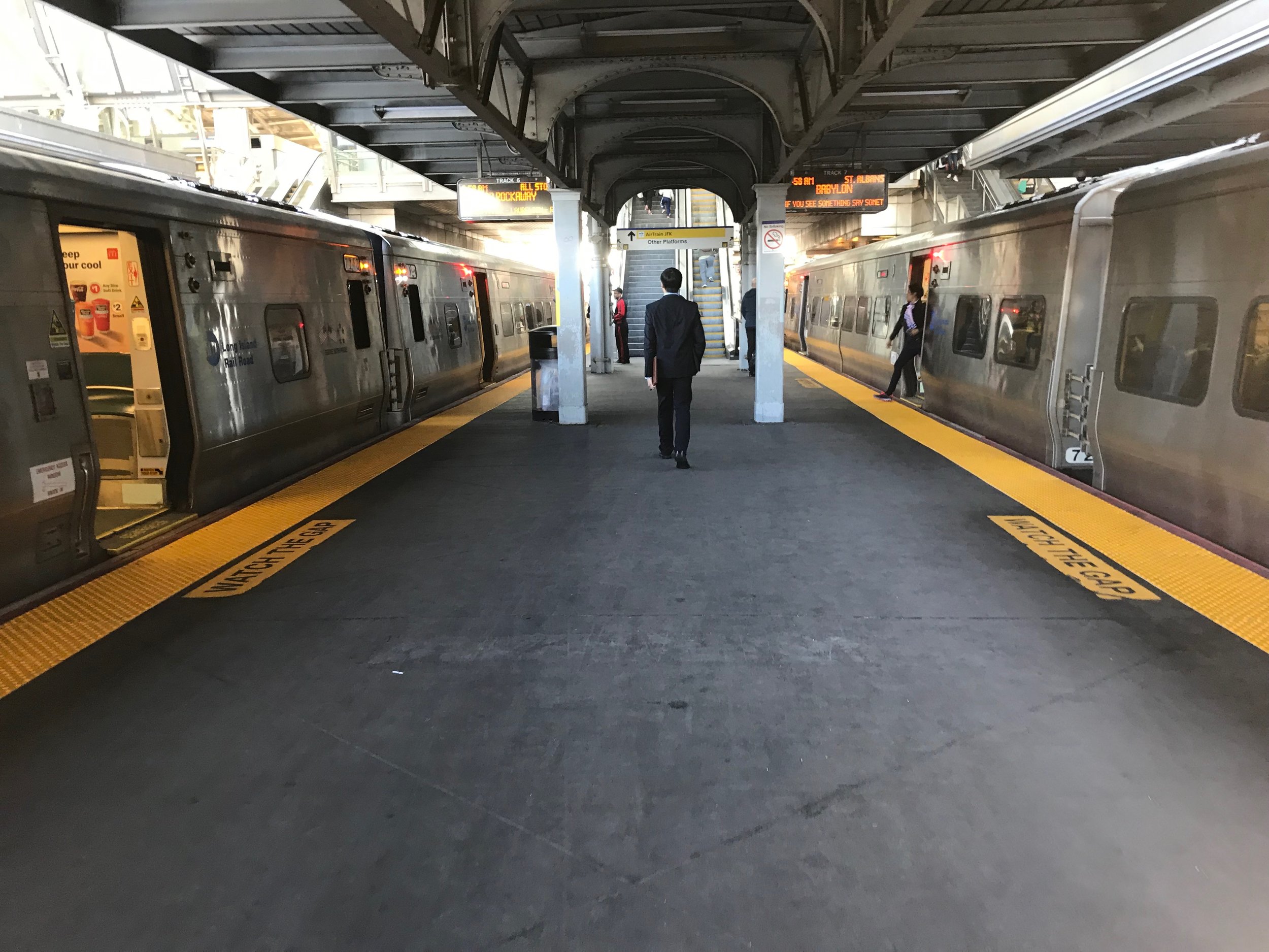 Two LIRR trains stop at the Jamaica station. Eagle photo by Jonathan Sperling.