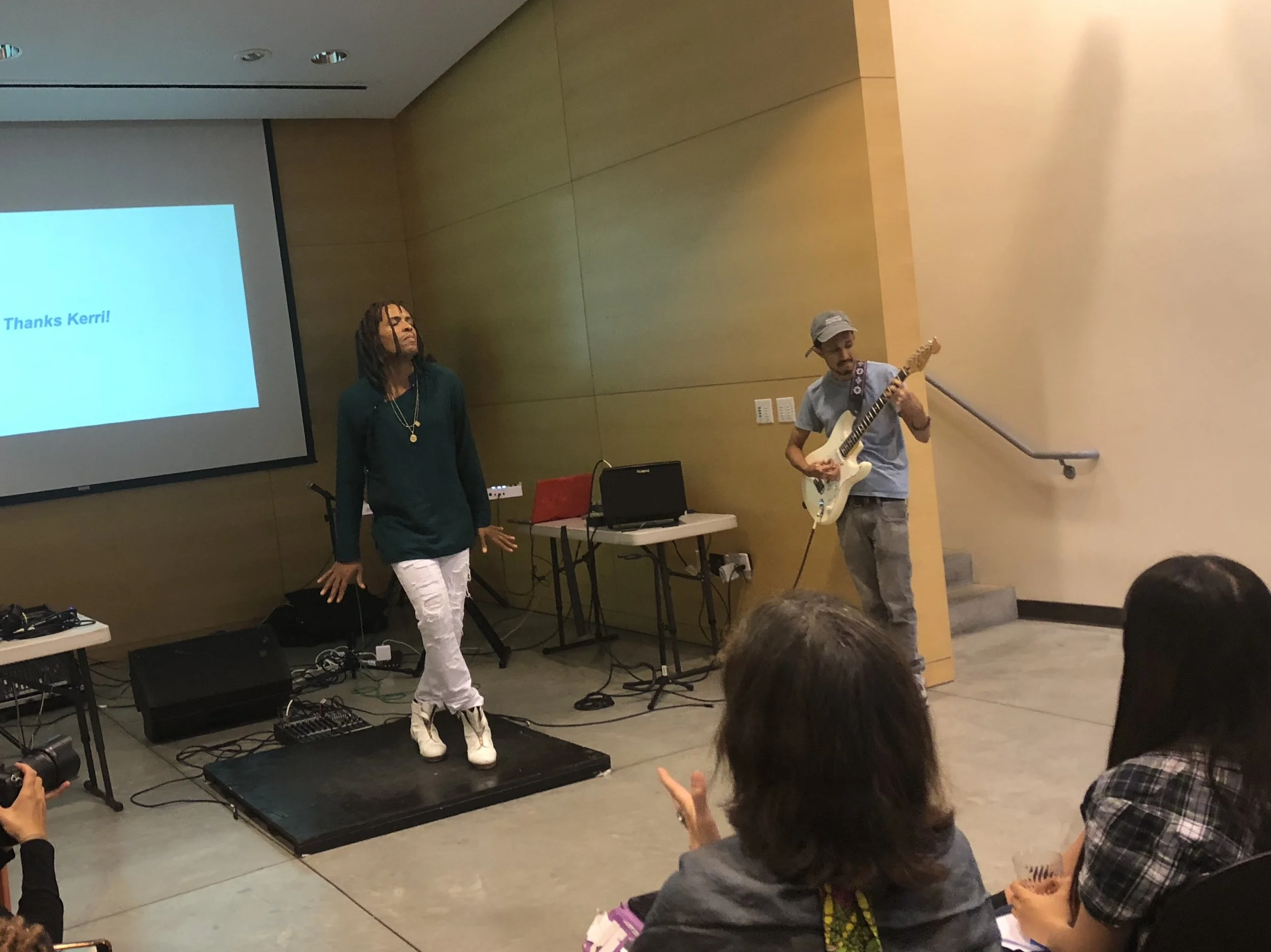 Omar Edwards and Yogi “Y?” Guyadin perform at a showcase for QCA-funded artists in July. Eagle photo by Victoria Merlino.