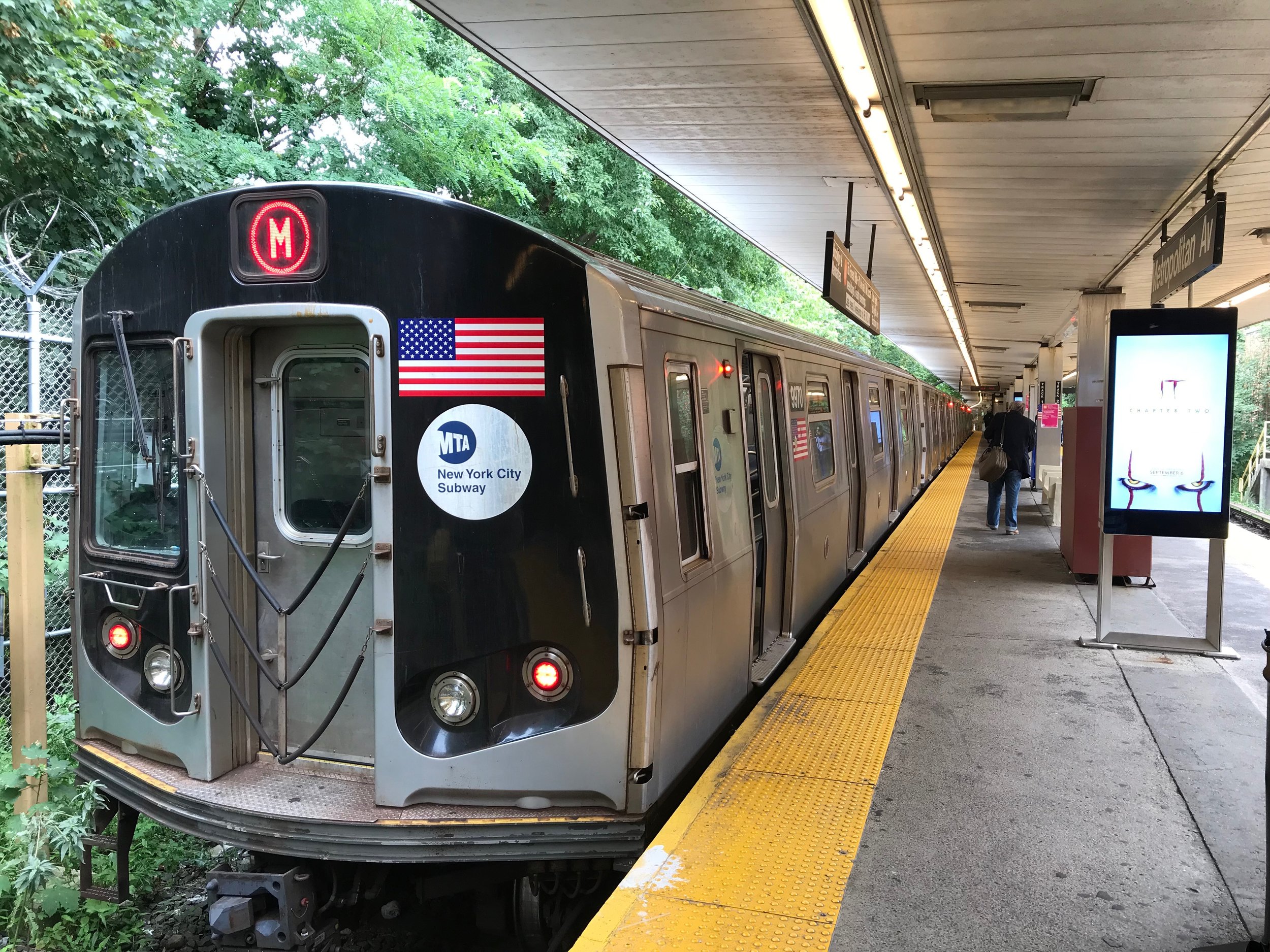 A train sits in the Metropolitan Avenue station in Middle Village, the last stop along the M line. Eagle photo by David Brand.