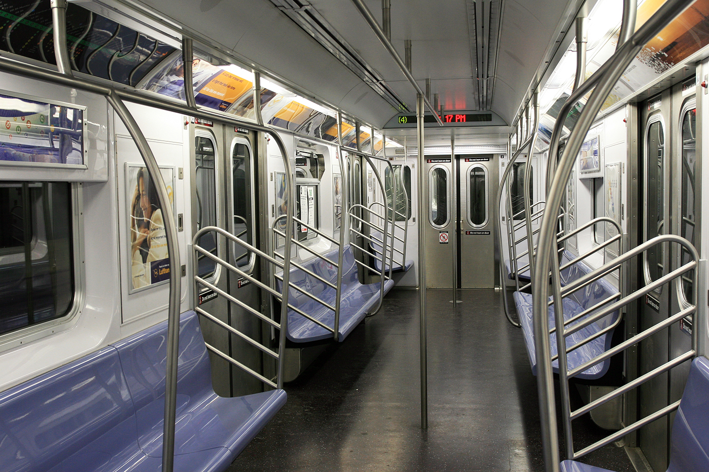 An empty subway car awaits passengers. Absolutewade via wikimedia commons.