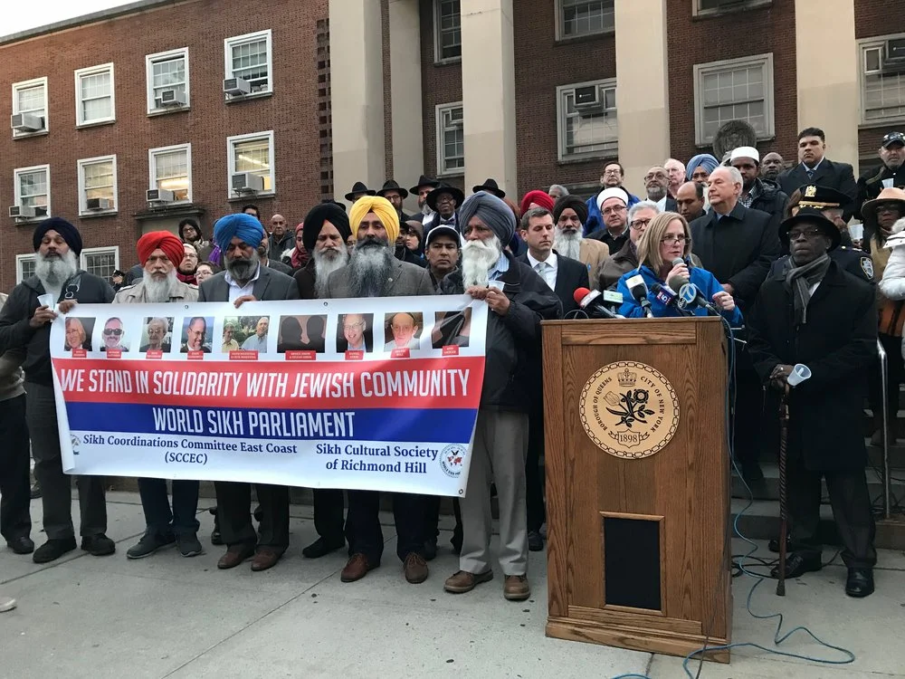 Community leaders, lawmakers and representatives of various faiths stood in solidarity against hate after a mass shooting at a synagogue in Pittsburgh in 2018. On Aug. 14, a vandal dumped anti-Semitic flyers outside the Halsey Street subway station in Ridgewood — the latest in a series of anti-Semitic incidents in Queens. Eagle file photo by David Brand.