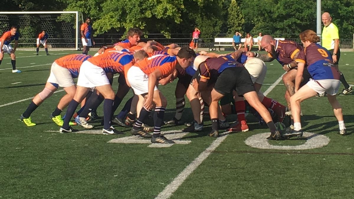 The Queens Rugby Club and the Old Maroon, a Fordham University alumni club, restart play in a scrum.