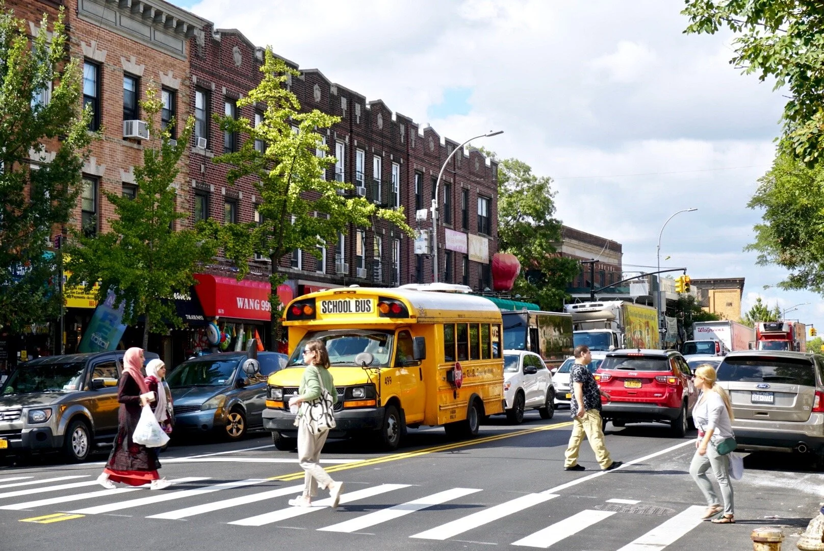 A lawsuit aims to stop the addition of express bus lanes on Fresh Pond Road, a busy commercial thoroughfare in the heart of Middle Village. Eagle photo by Luca Powell