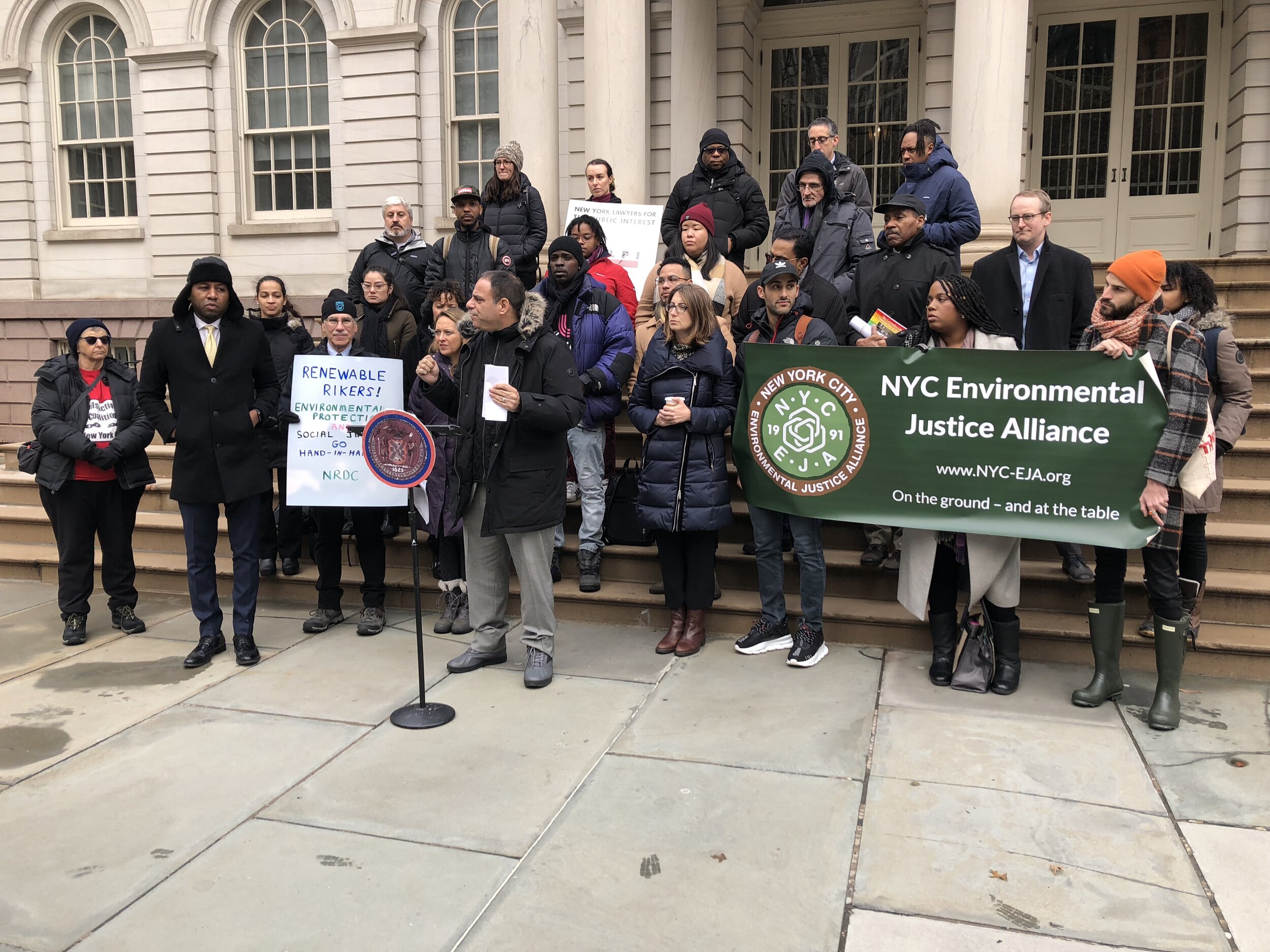 Environmental sustainability advocates rally outside City Hall on Wednesday in favor of a bill that will turn Rikers Island into a Renewable energy powerhouse. Eagle photo by Victoria Merlino.