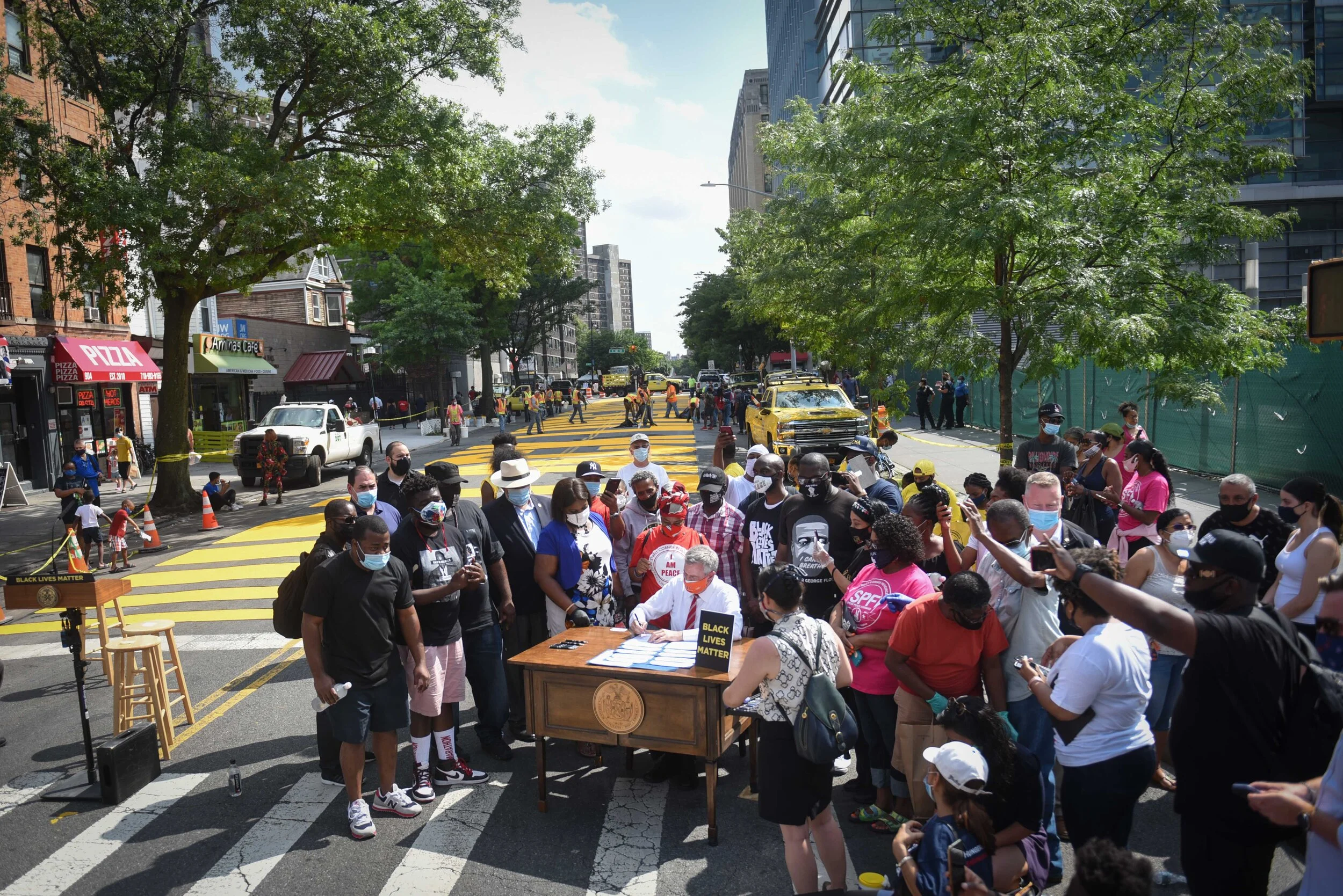 Mayor Bill de Blasio signed several police reform bills into law next to a Black Lives Matter street mural in the Bronx Wednesday. Photo by Michael Appleton/Mayoral Photography