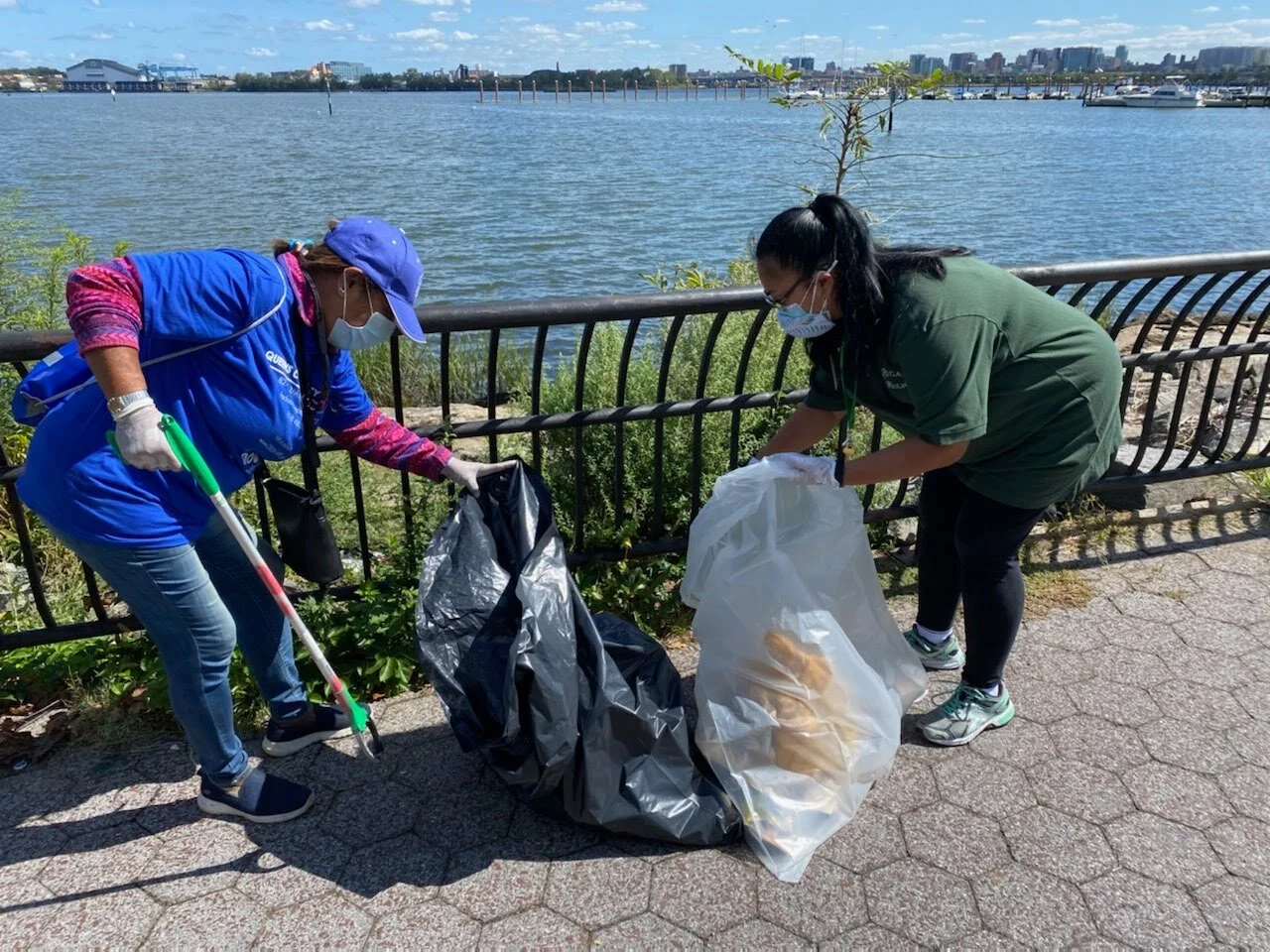 Volunteers pick trash from Flushing Bay Promenade on City of Water Day