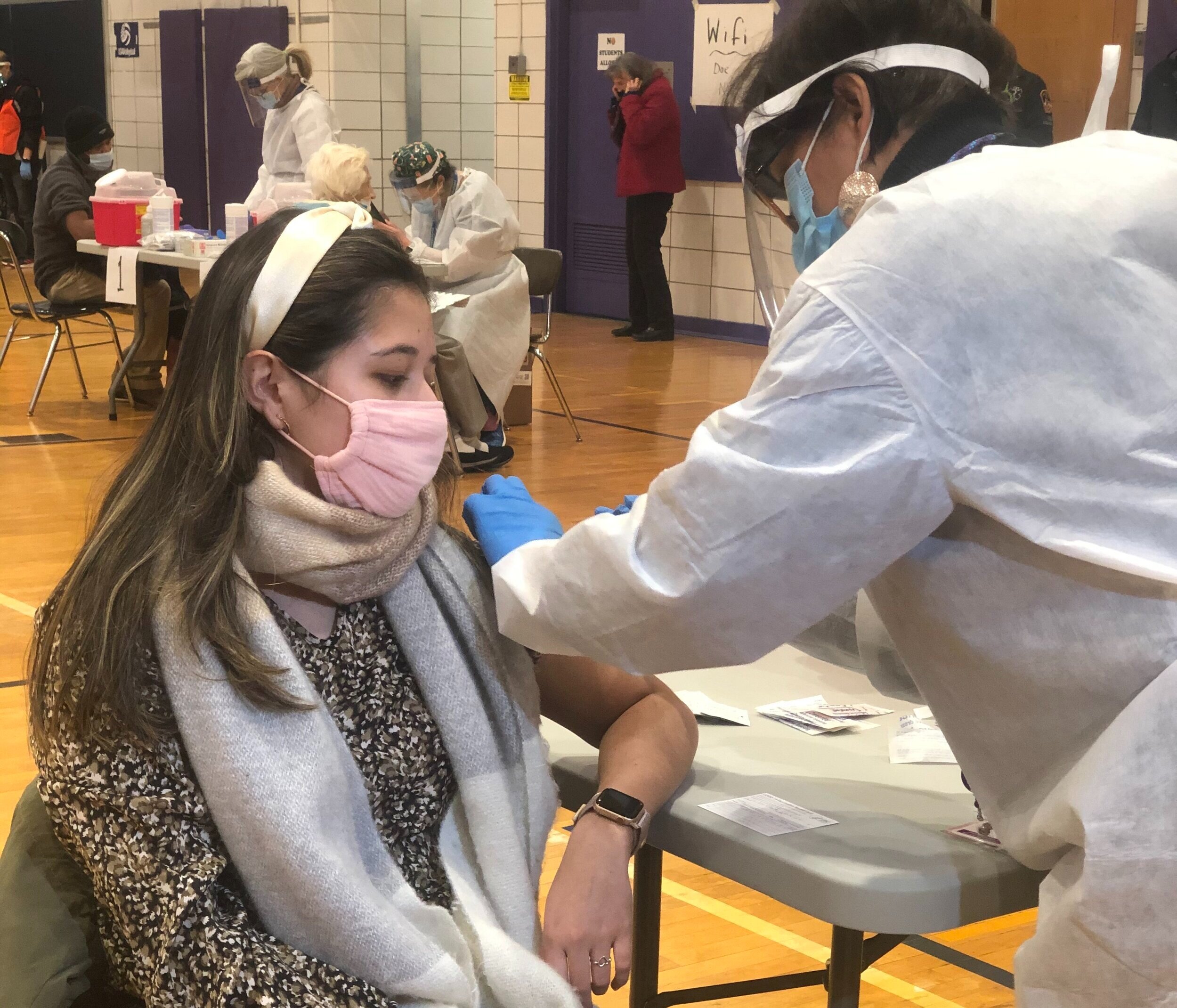 Hundreds head to Queens high school for first COVID-19 vaccines