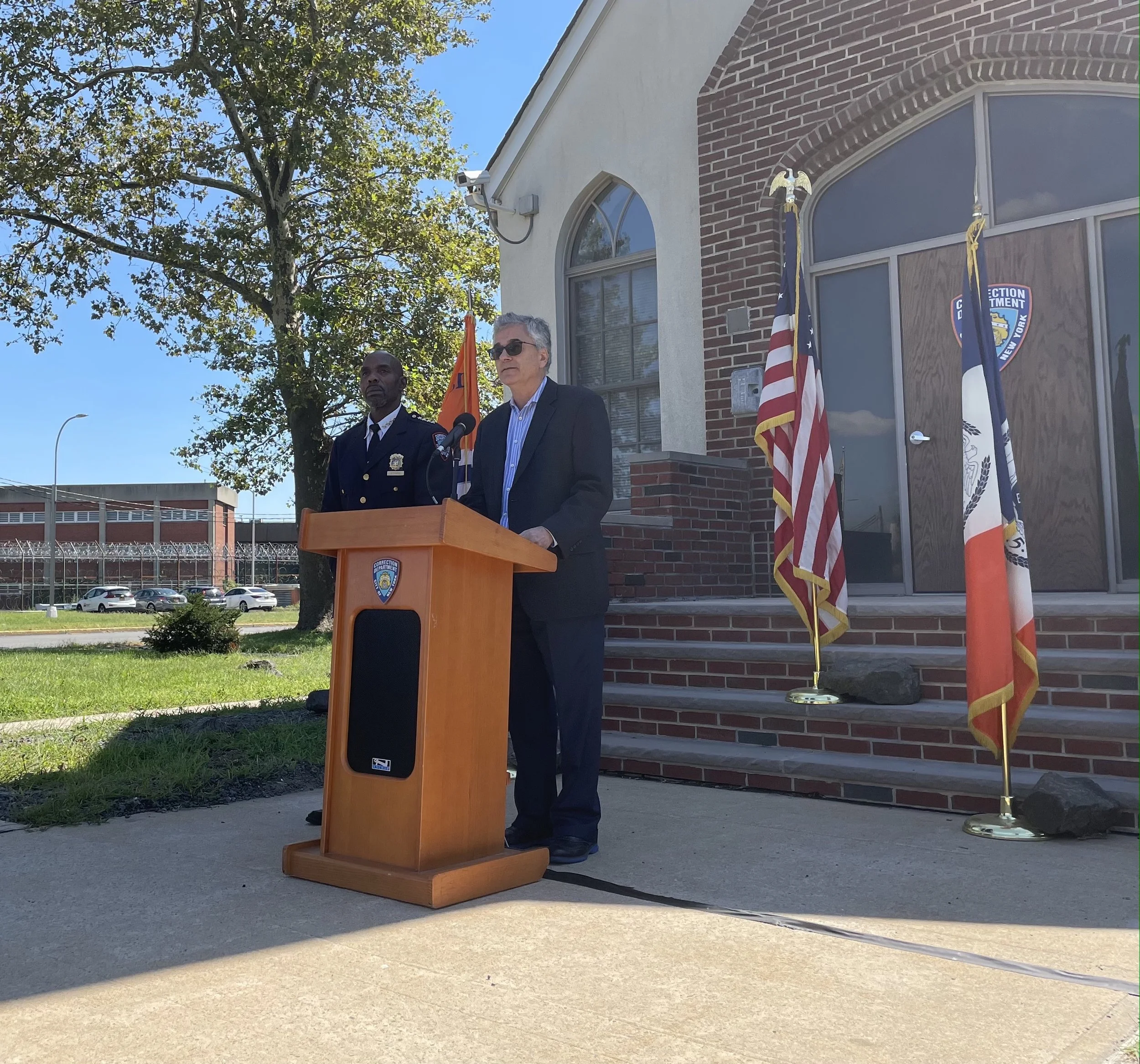 COVID spikes on Rikers, services cut