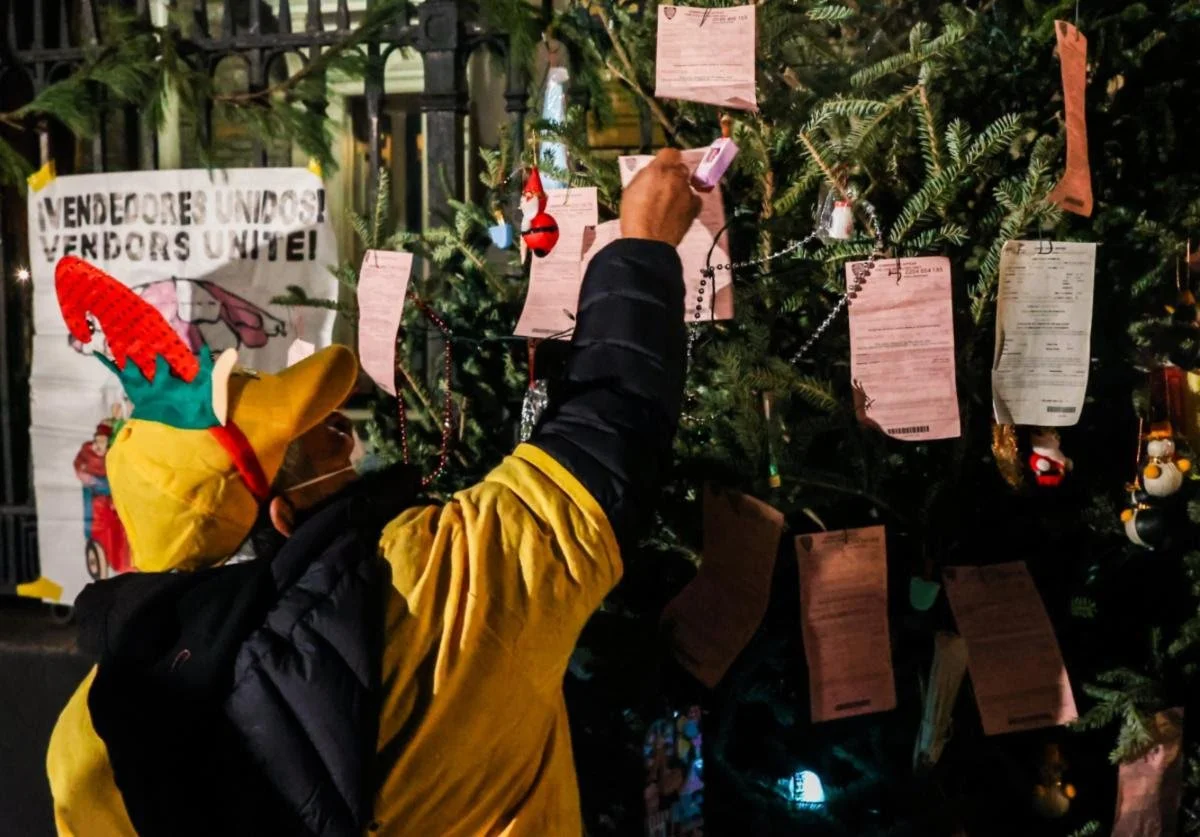 Vendors rally against fines and permit caps