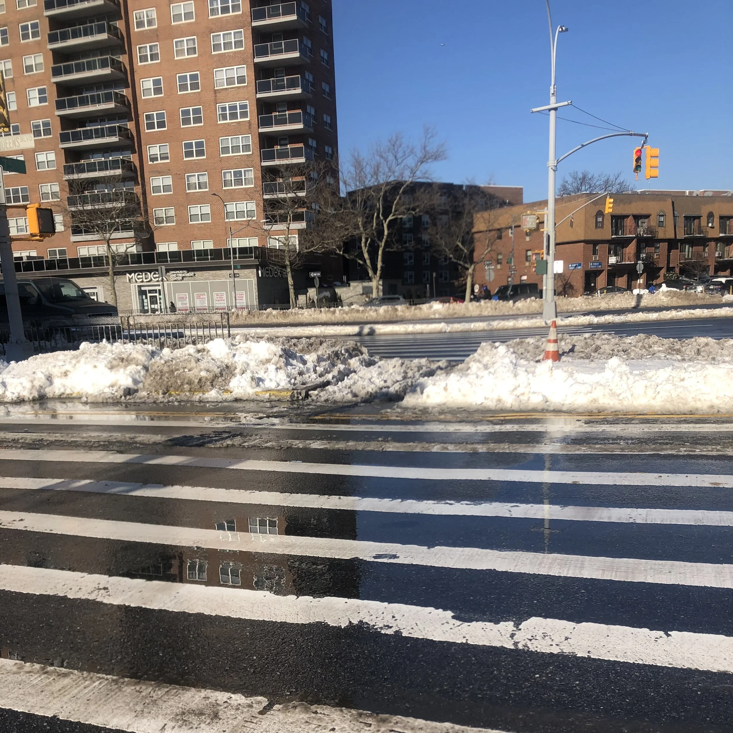 Snow buildup on Queens walkways hinders mobility for some
