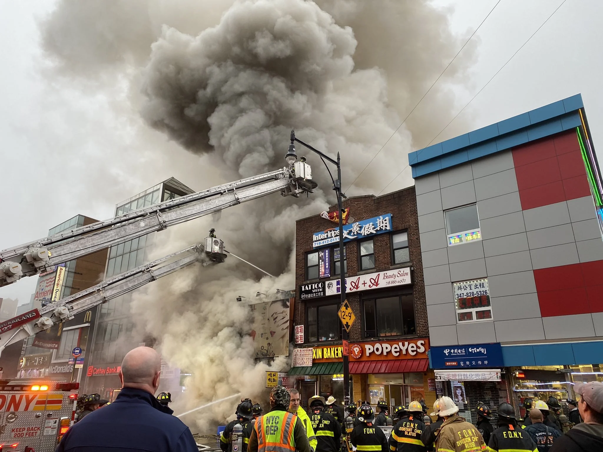 Five-alarm Flushing fire tears through mall