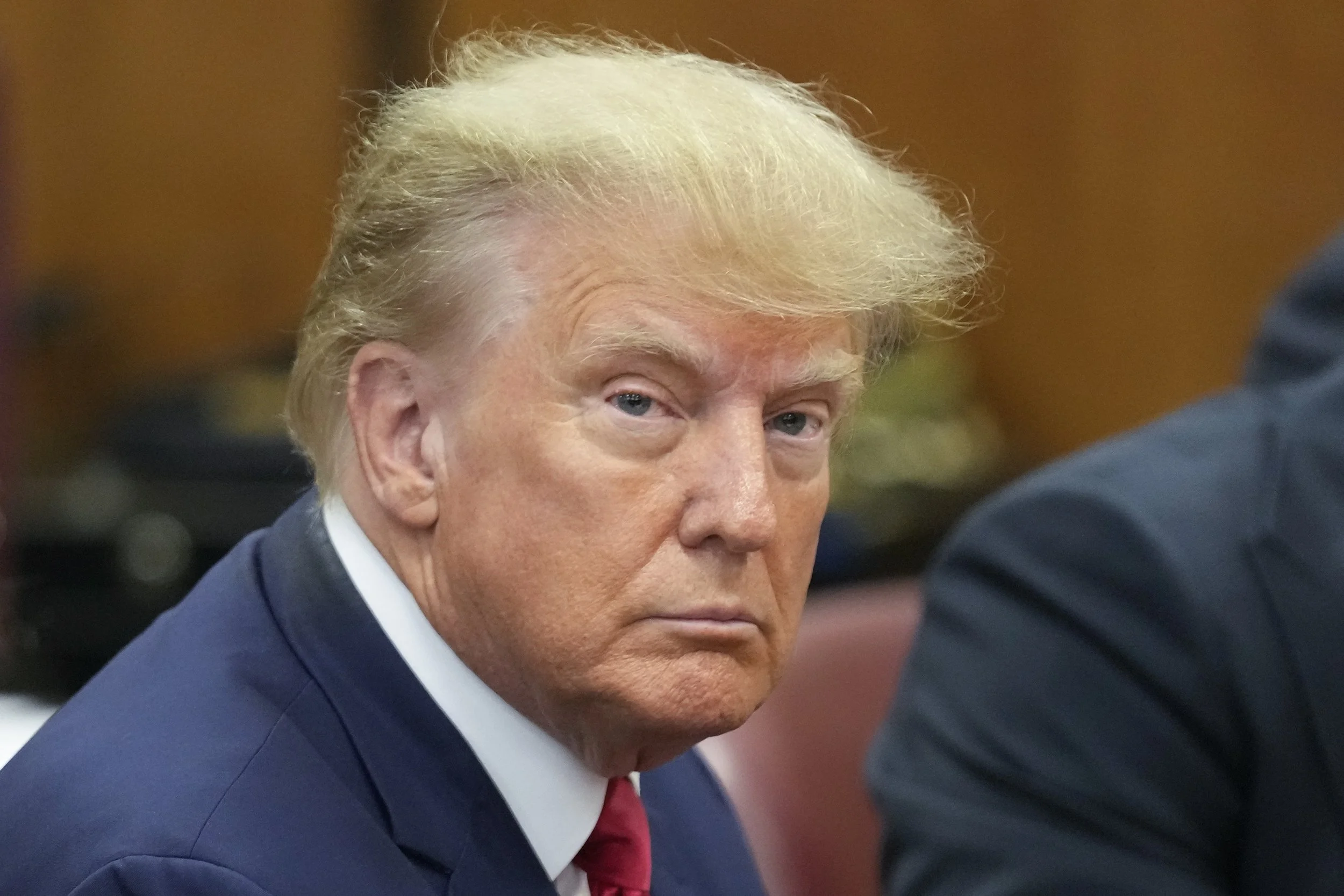 Queens man arrested: As Trump faces felony charges, Queens goes about its daily life