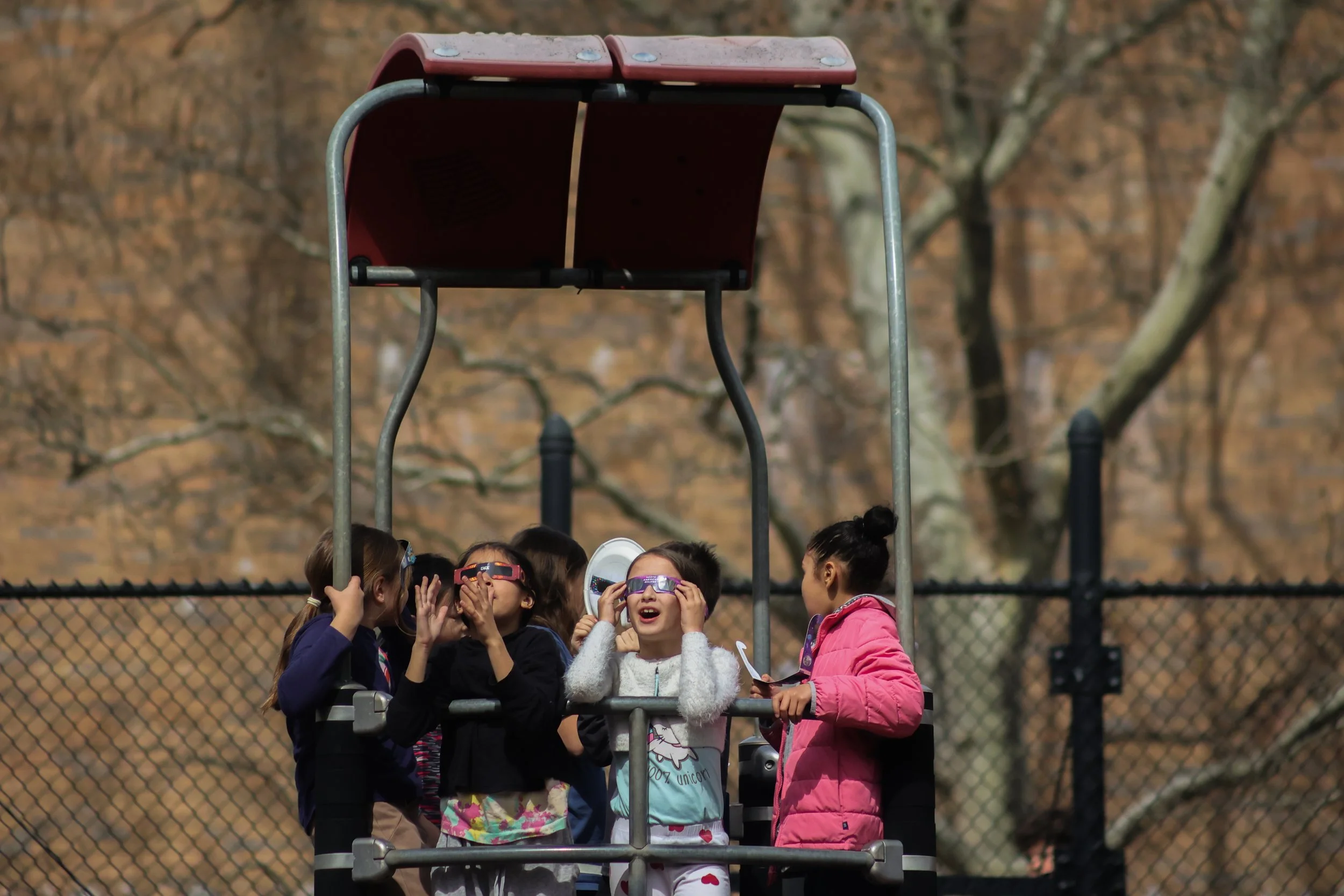 Queens takes in the solar eclipse 