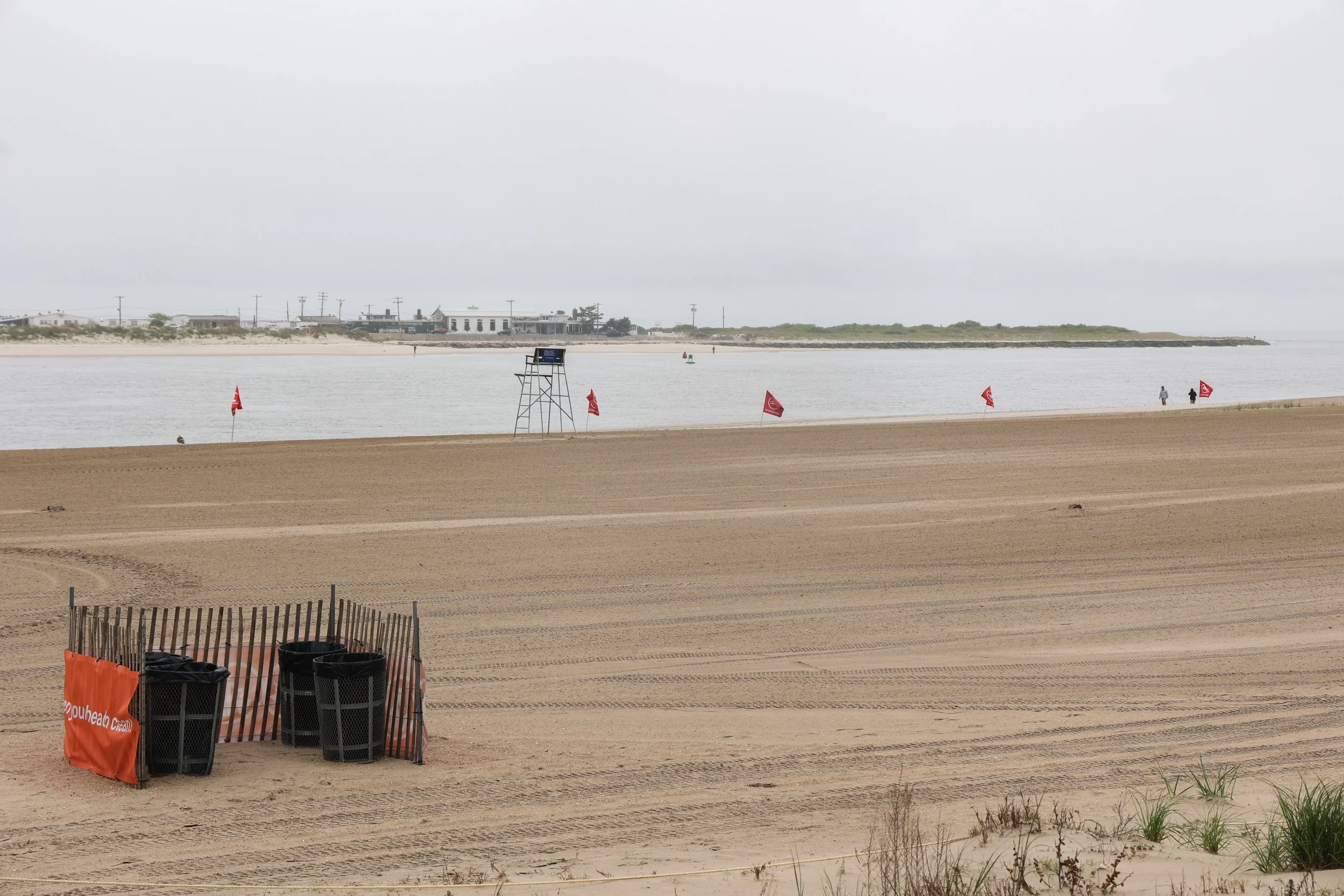 Queens’ beaches open for summer despite gloomy weather