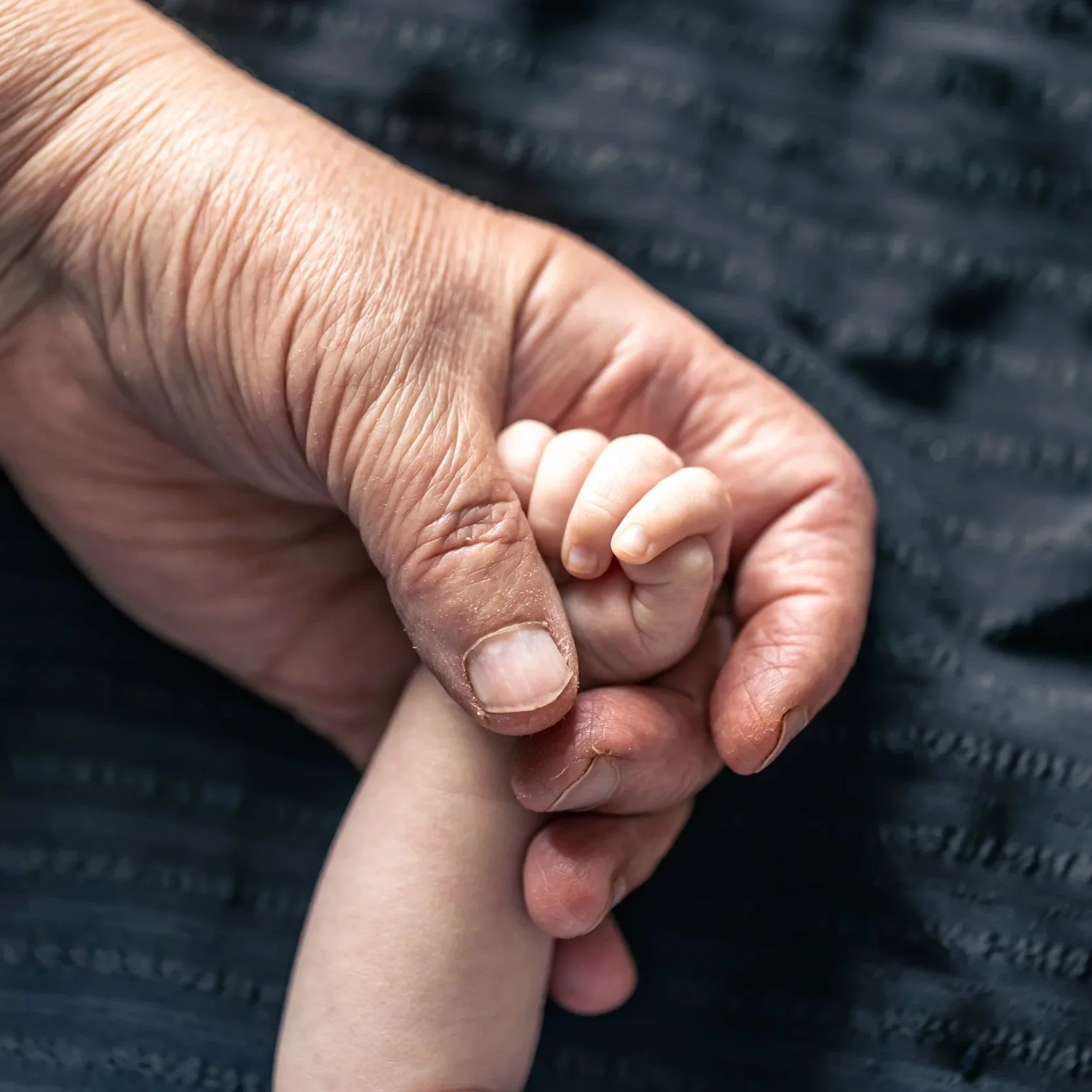 hands-senior-person-little-baby-close-up.jpg