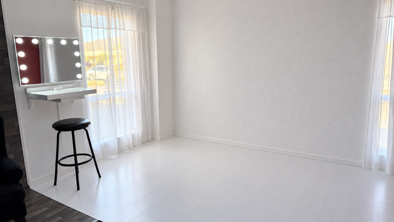 Minimalist White Makeup Studio with Vanity Lights.png