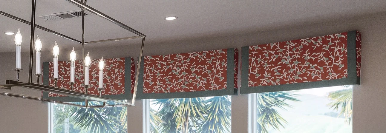 Tailored valances with custom details on a curved wall! What a showcase!