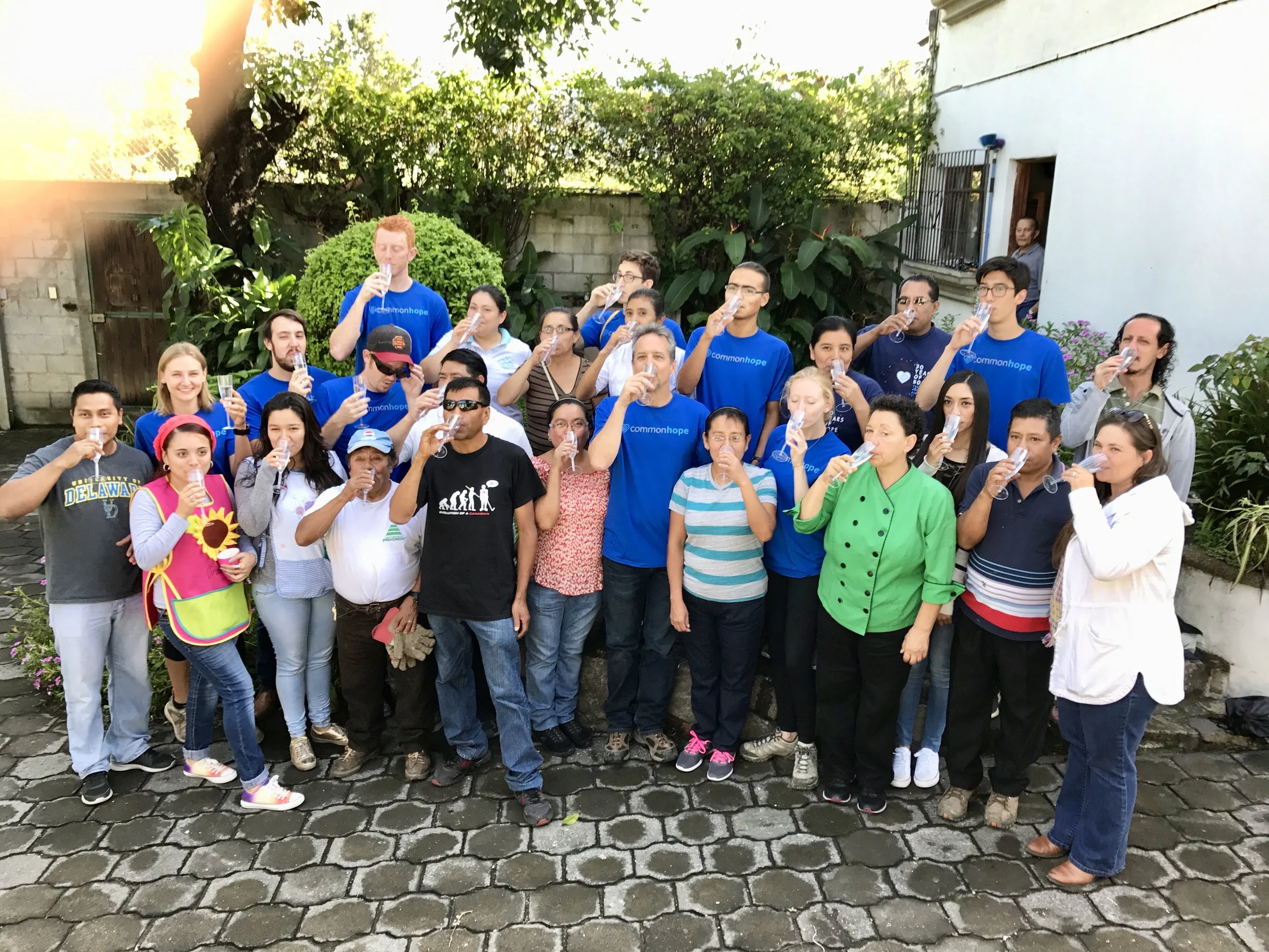 Sampling the newly filtered drinking water at the Common Hope campus during the 2017 Guatemala project implementation trip.