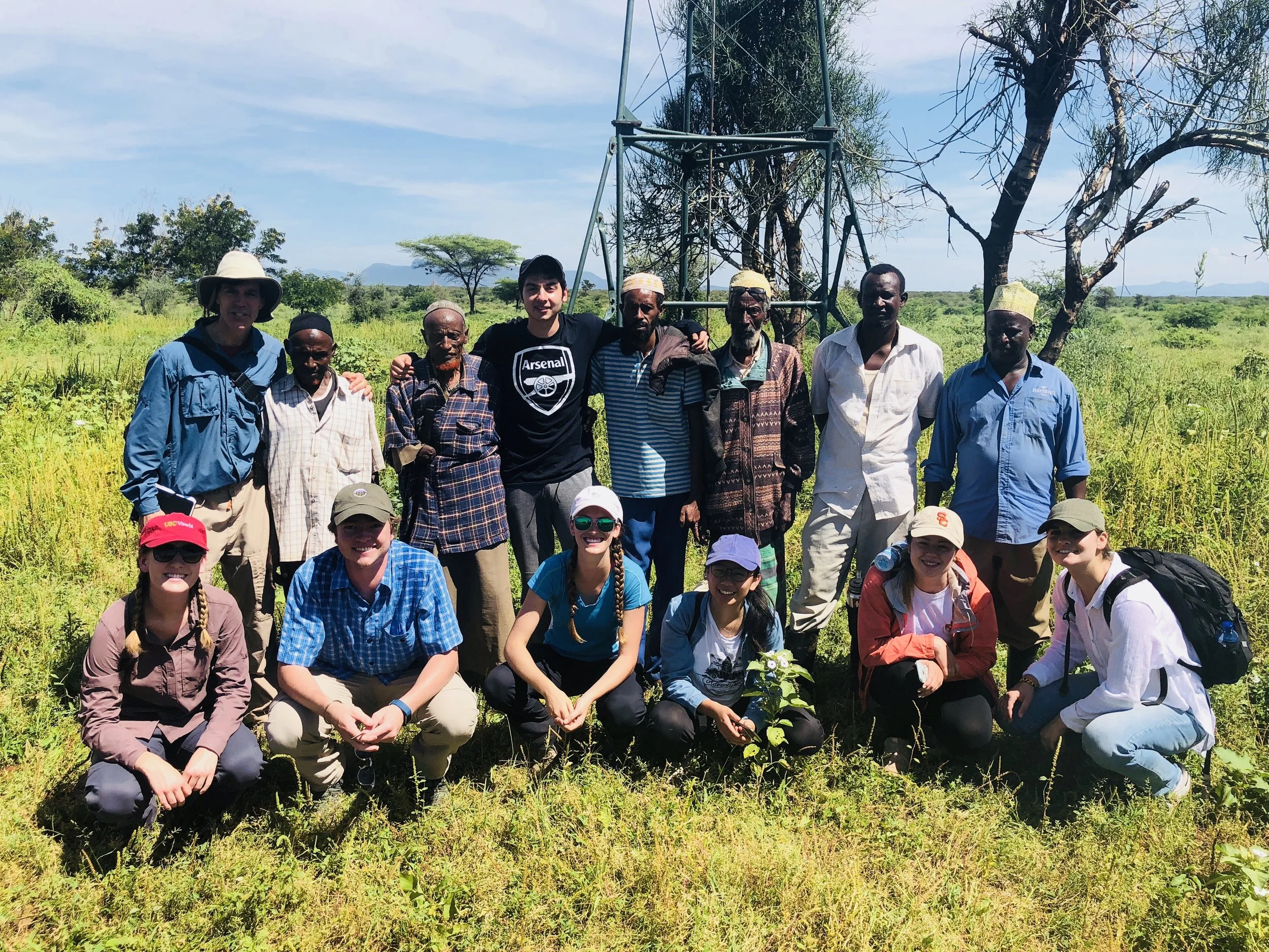 Students with Gambella tribe leaders having discussed the future of the Gambella windmill.