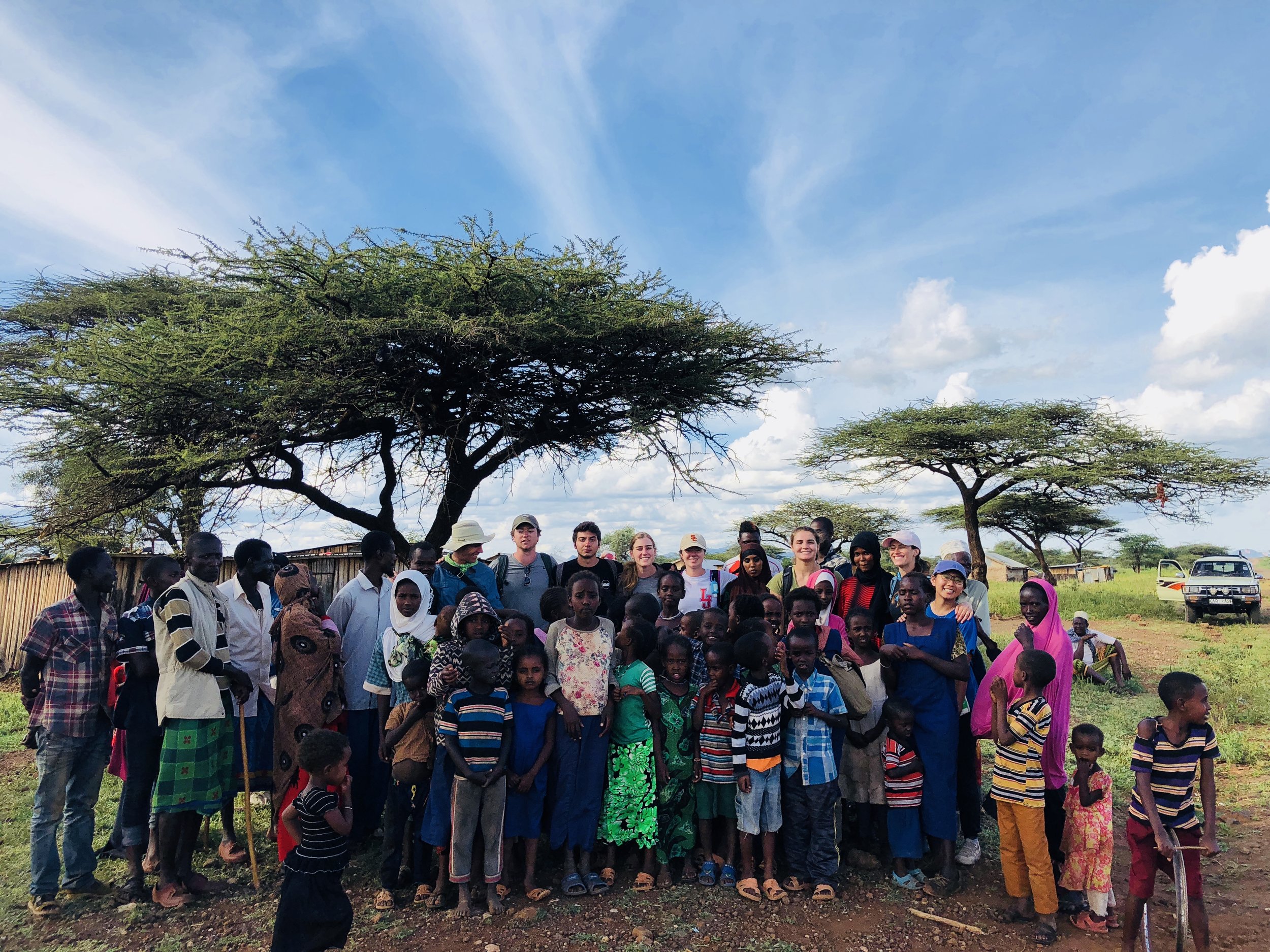 The Kenya project travel team with members of the Gambella community.