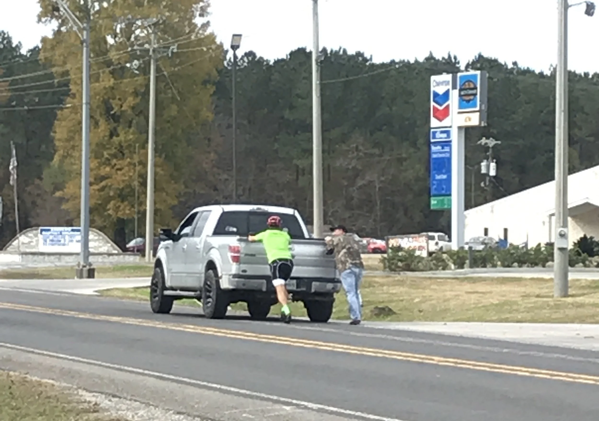 Dad helped local push there truck to the gas station after it ran out of gas.