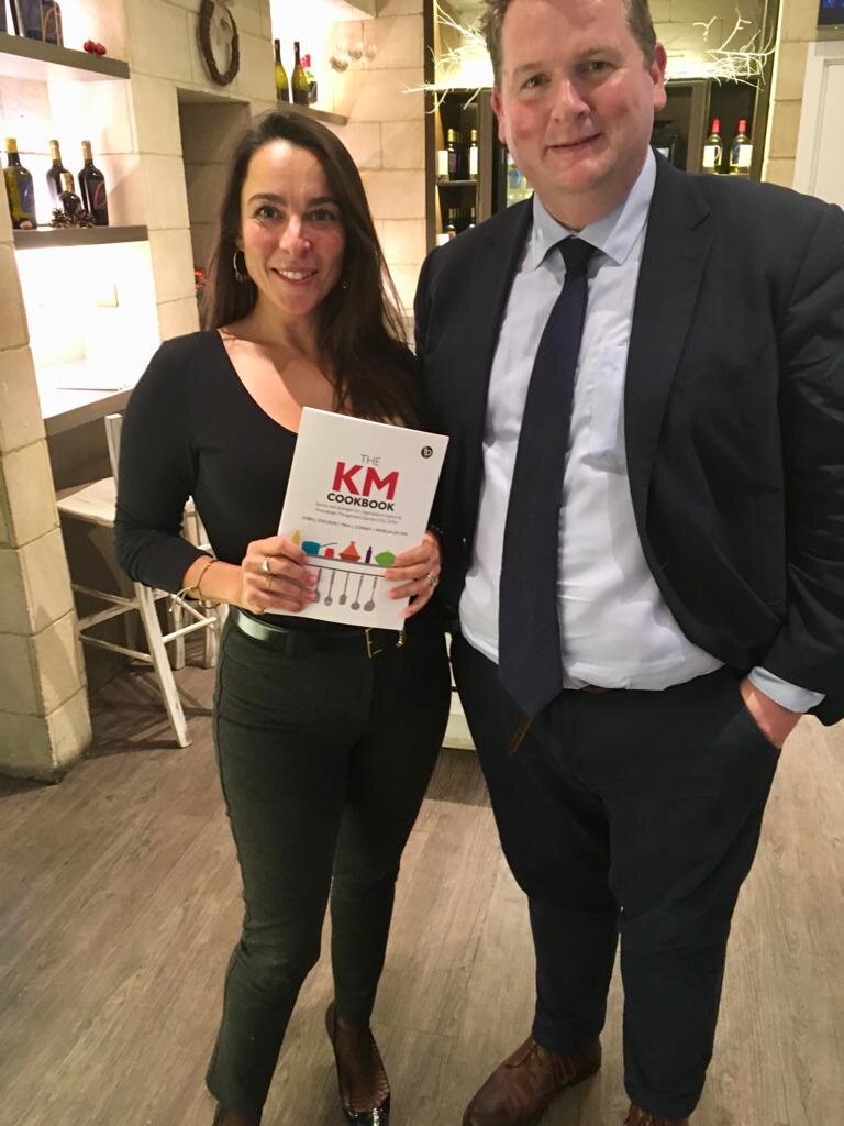 Monica Danese-Perrin from Lloyds Bank pictured, Cookbook-in-hand with Nick Poole, CILIP Chief Executive