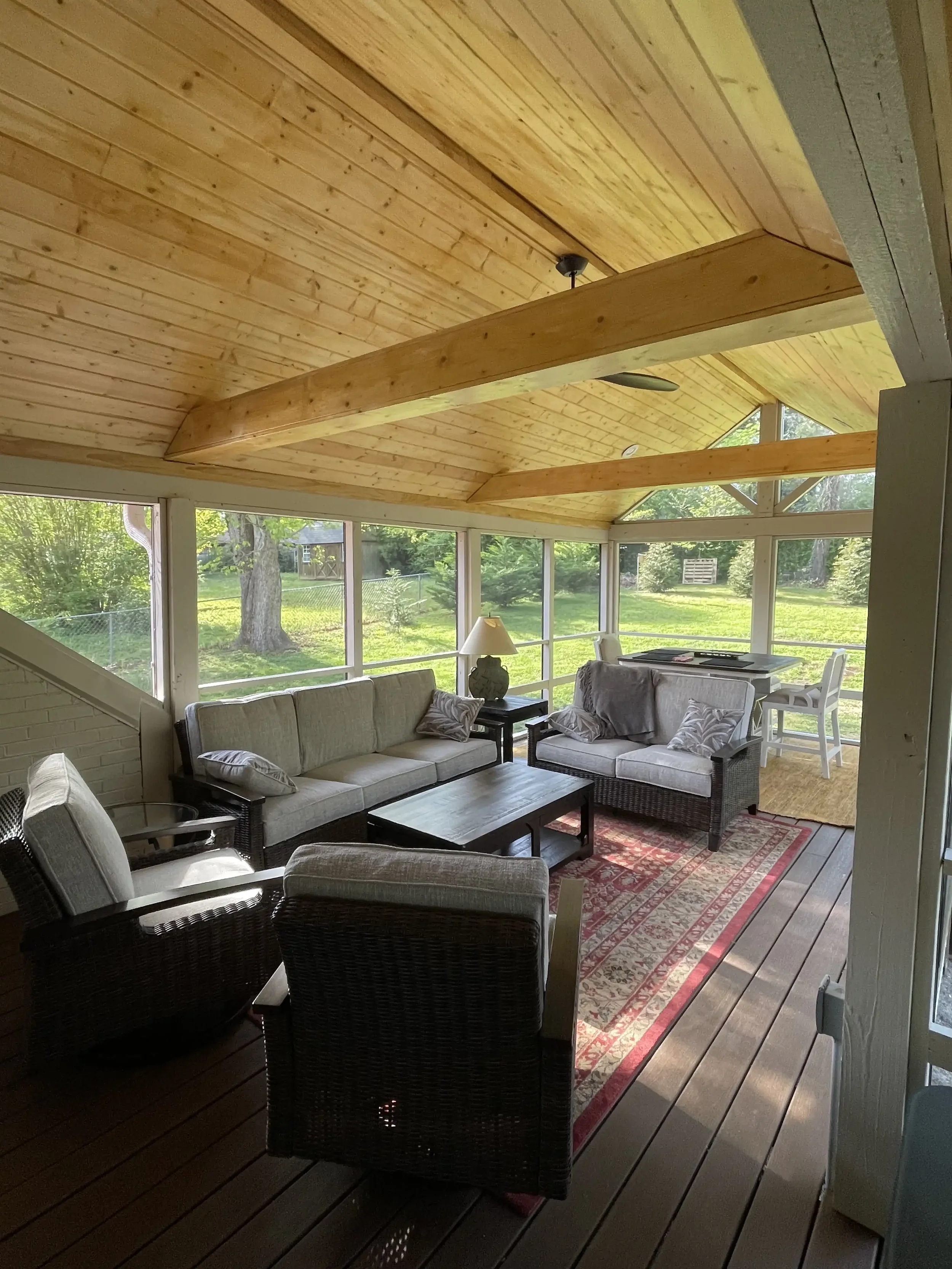Brightly lit seating area in a covered sunroom