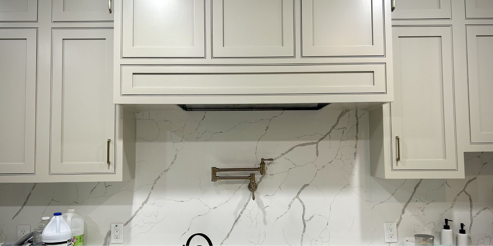 white marble full-height backsplash in renovated kitchen