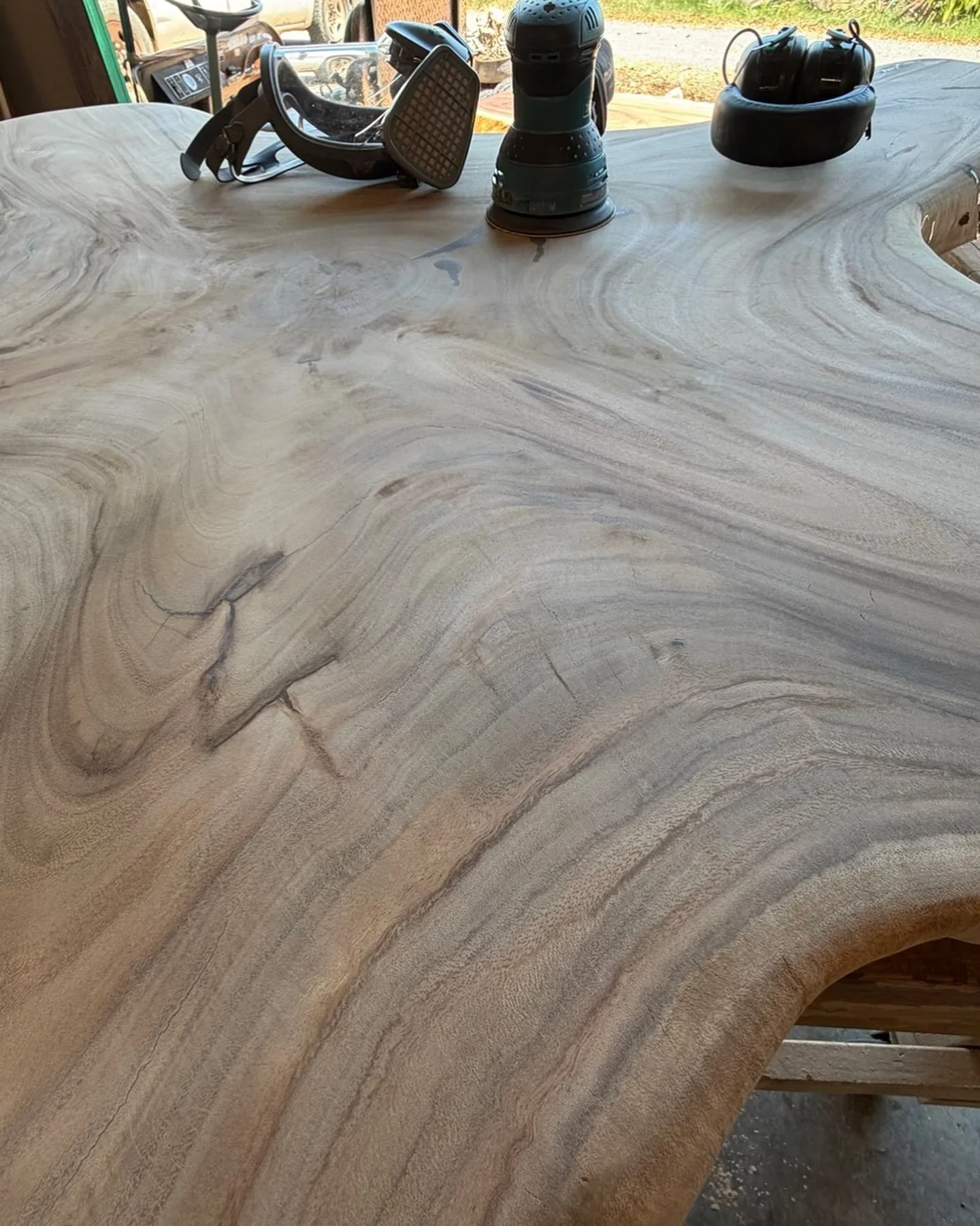 Sanding and prepping our monkeypod wood slabs for our custom orders. Stay tuned for the stunning finished products! Woodworkinghawaii.com #hawaiianhardwood #customwoodfurniture #solidwoodslabs #wooddiningtable #monkeypod