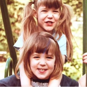 That’s me with my twin sister. I’m on the bottom.