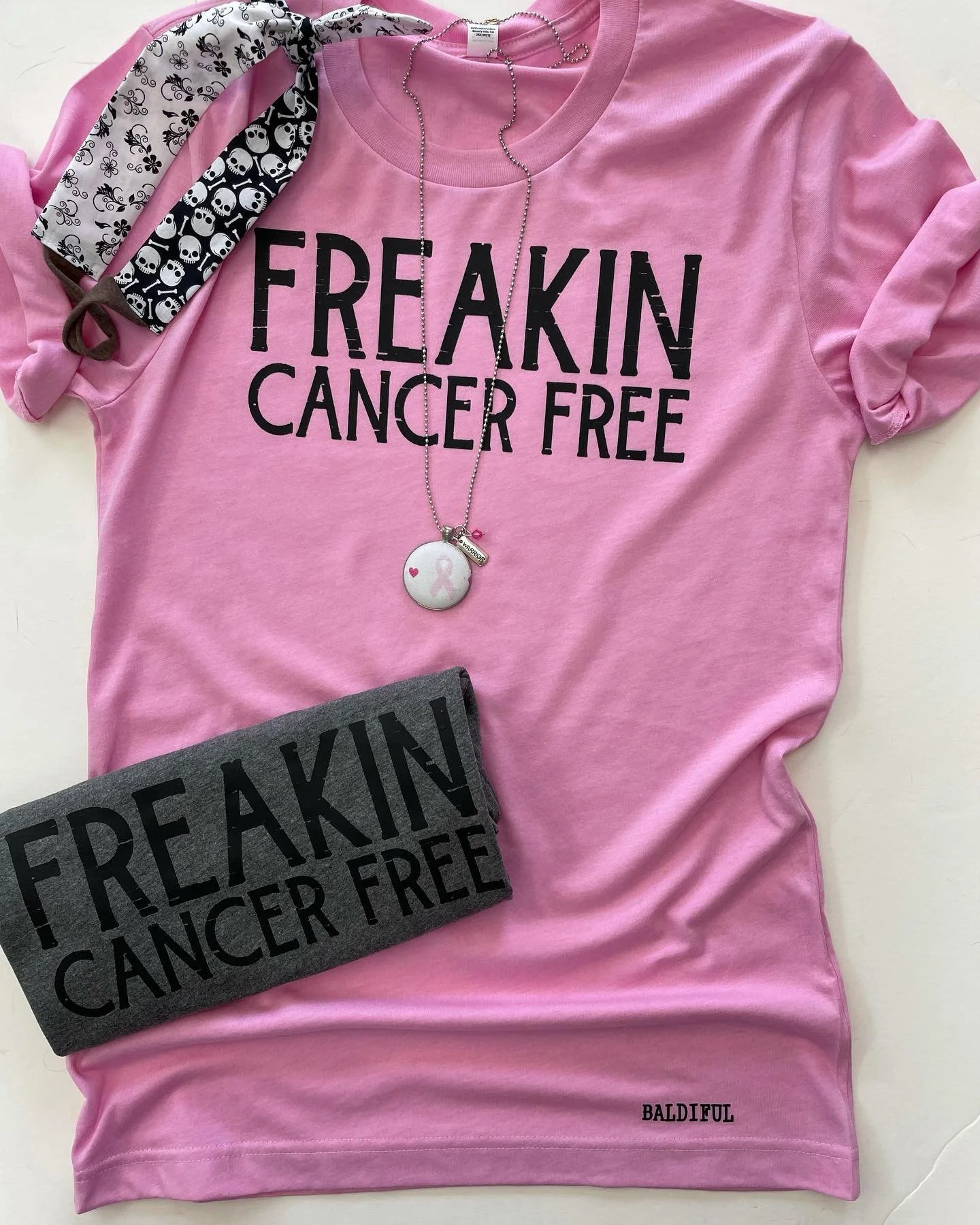 Freakin Cancer Free 💪🏼 Available in multiple colors. Shop in store at @garagedoorapparelcompany or online(link in bio). Featured with @tielitestyle headband and @artfulanniekc warrior pendant.