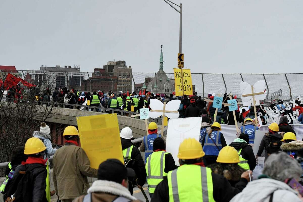 Excluded workers march to Capitol eyeing $3B more in benefits
