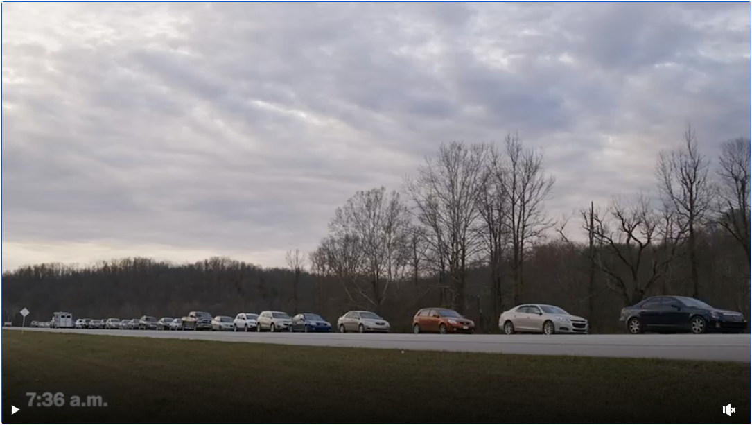 A mile-long line for free food offers a warning as covid benefits end