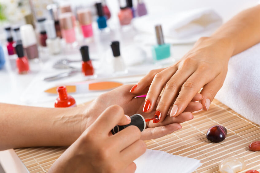Nail salon woman hands treatment. Nail saloon woman painting color nail  polish in hands stock photo. 065 Stock Photo - Alamy