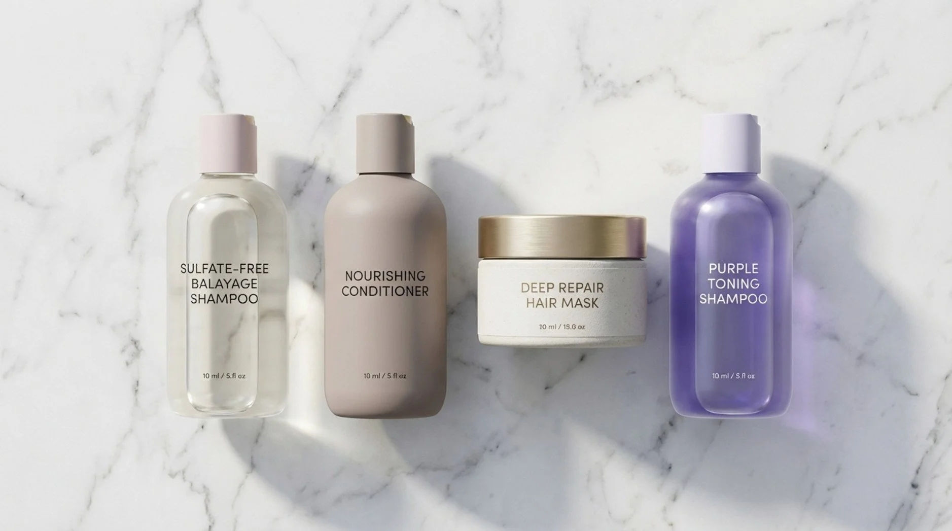 A flat lay of essential hair care products for balayage on a marble surface, including sulfate-free shampoo conditioner hair mask and purple toning shampoo.